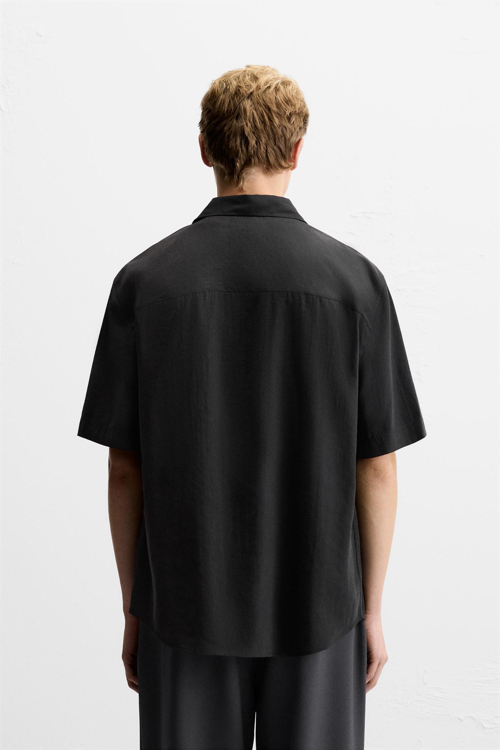 Relaxed fit shirt made of modal blend fabric. Lapel collar and short sleeves. Front button closure. Product Image
