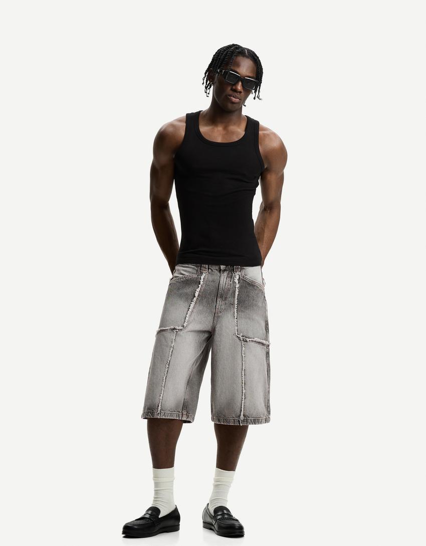 Baggy denim Bermuda shorts with fringing Product Image