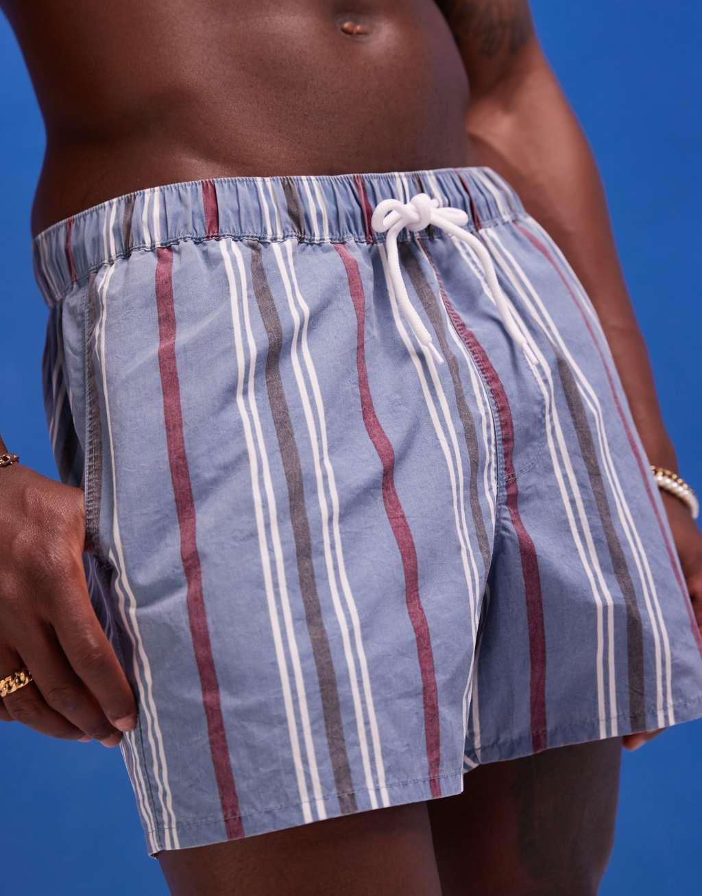 ASOS DESIGN swim shorts in mid length in blue acid wash Product Image