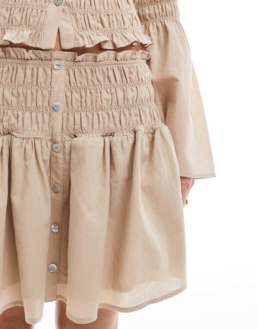 ASOS DESIGN shirred drop waist mini skirt in neutral Product Image
