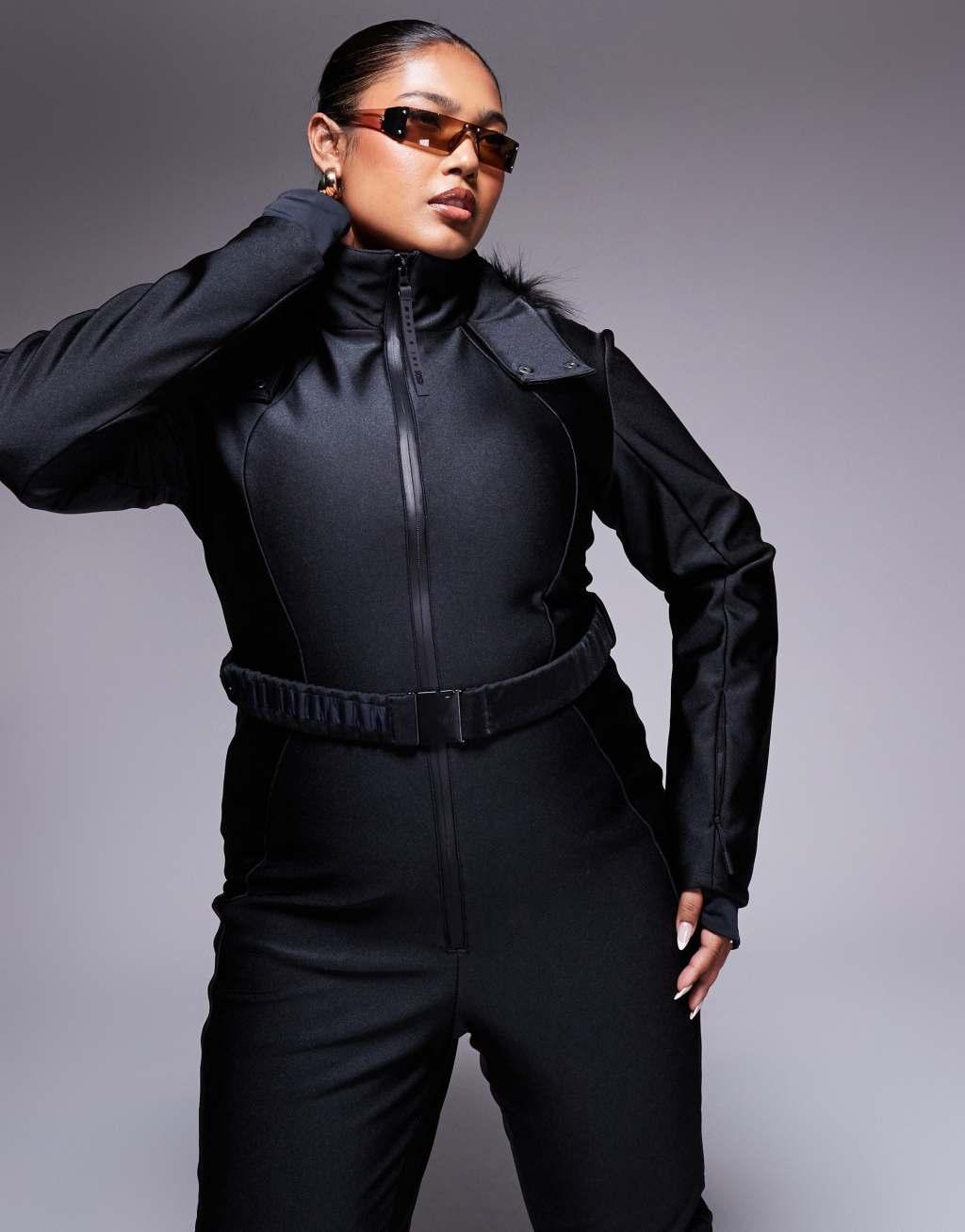 4505 Curve belted ski suit with slim kick leg and faux fur hood in black gloss  Product Image