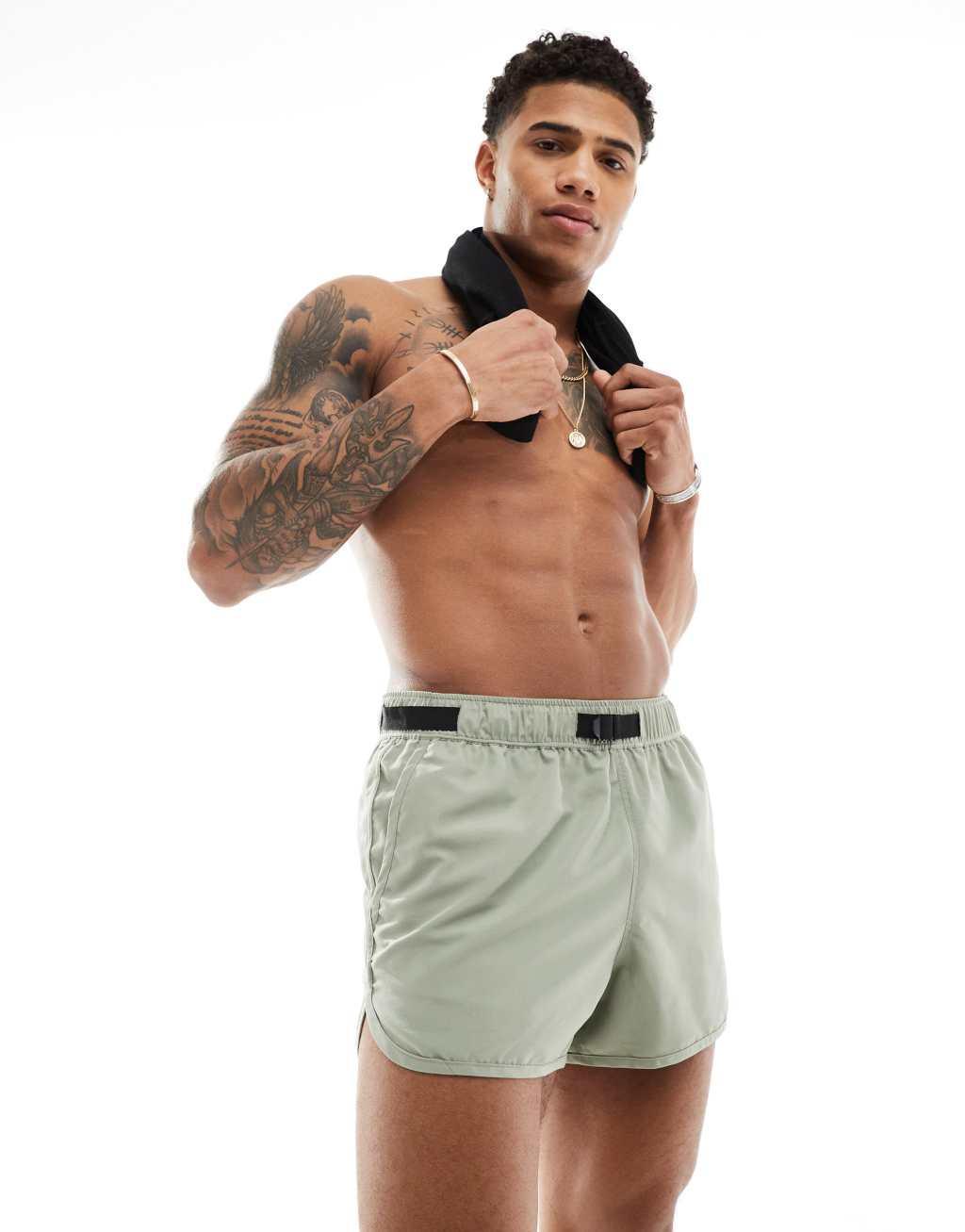 ASOS DESIGN swim shorts in short length in sage with webbed belt Product Image