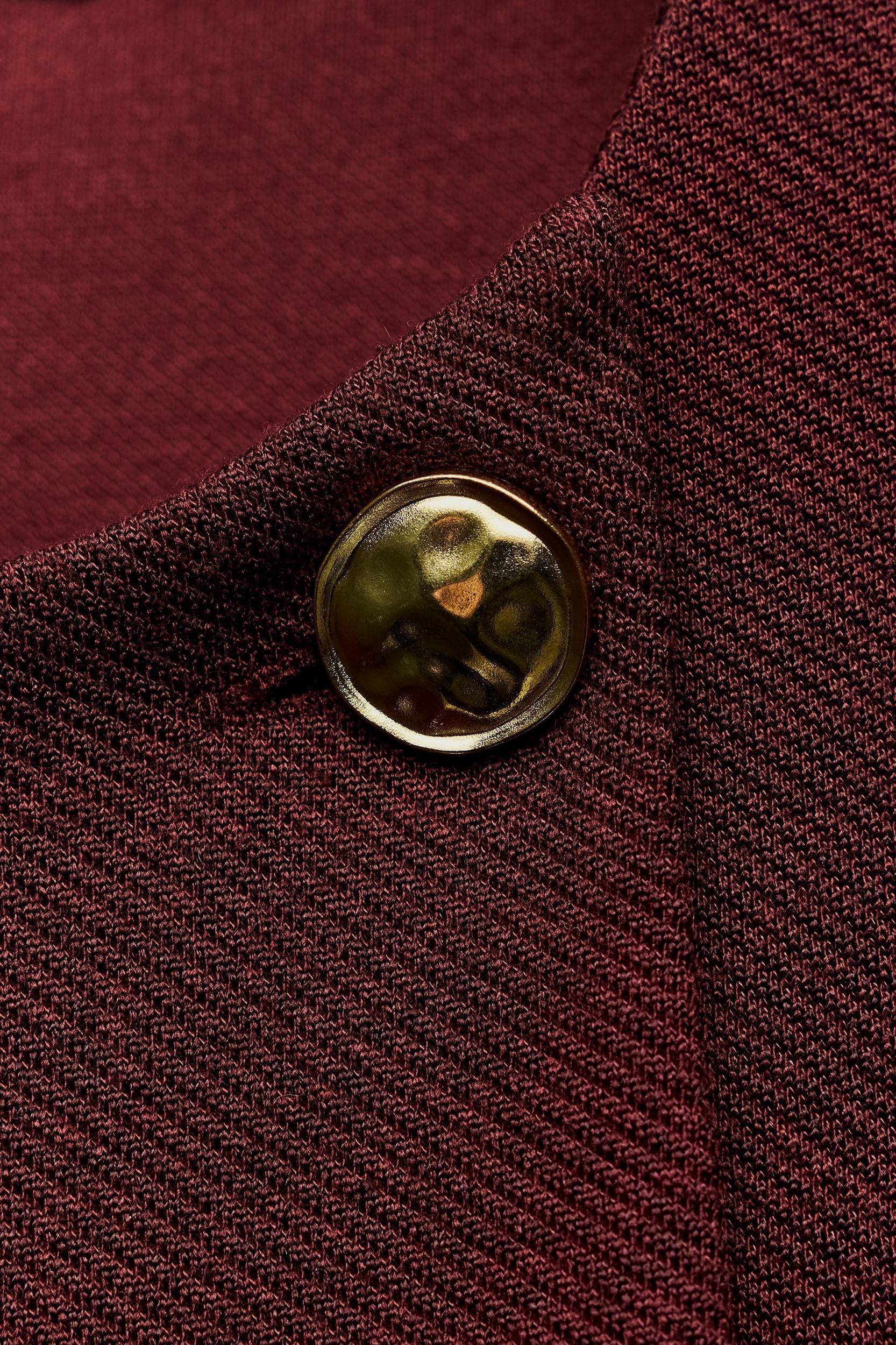 BUTTON CAPE Product Image