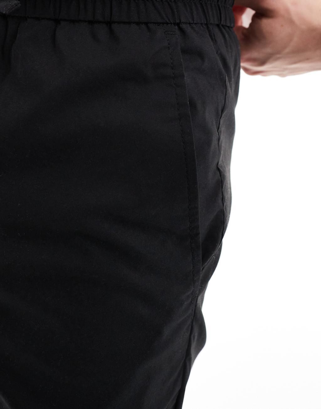 ONLY & SONS pull on tapered fit pants in black Product Image