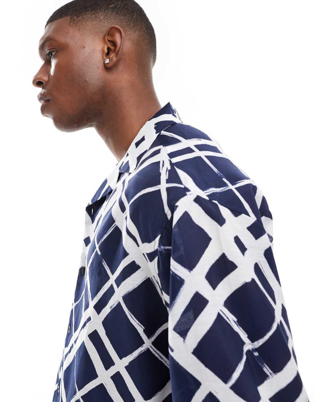ASOS DESIGN oversized camp collar shirt with brush stroke plaid print in navy Product Image