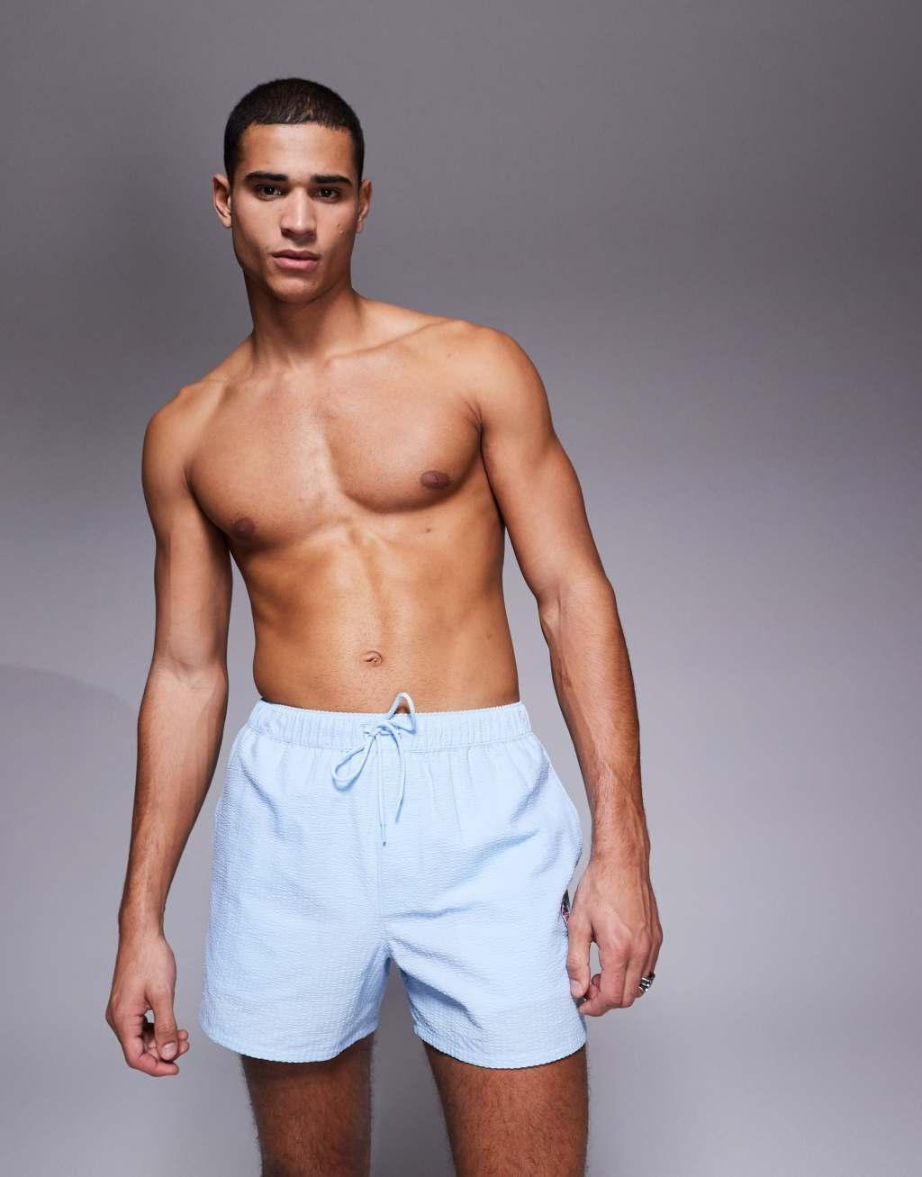 ASOS DESIGN seersucker swim shorts in short length with embroidery   Product Image