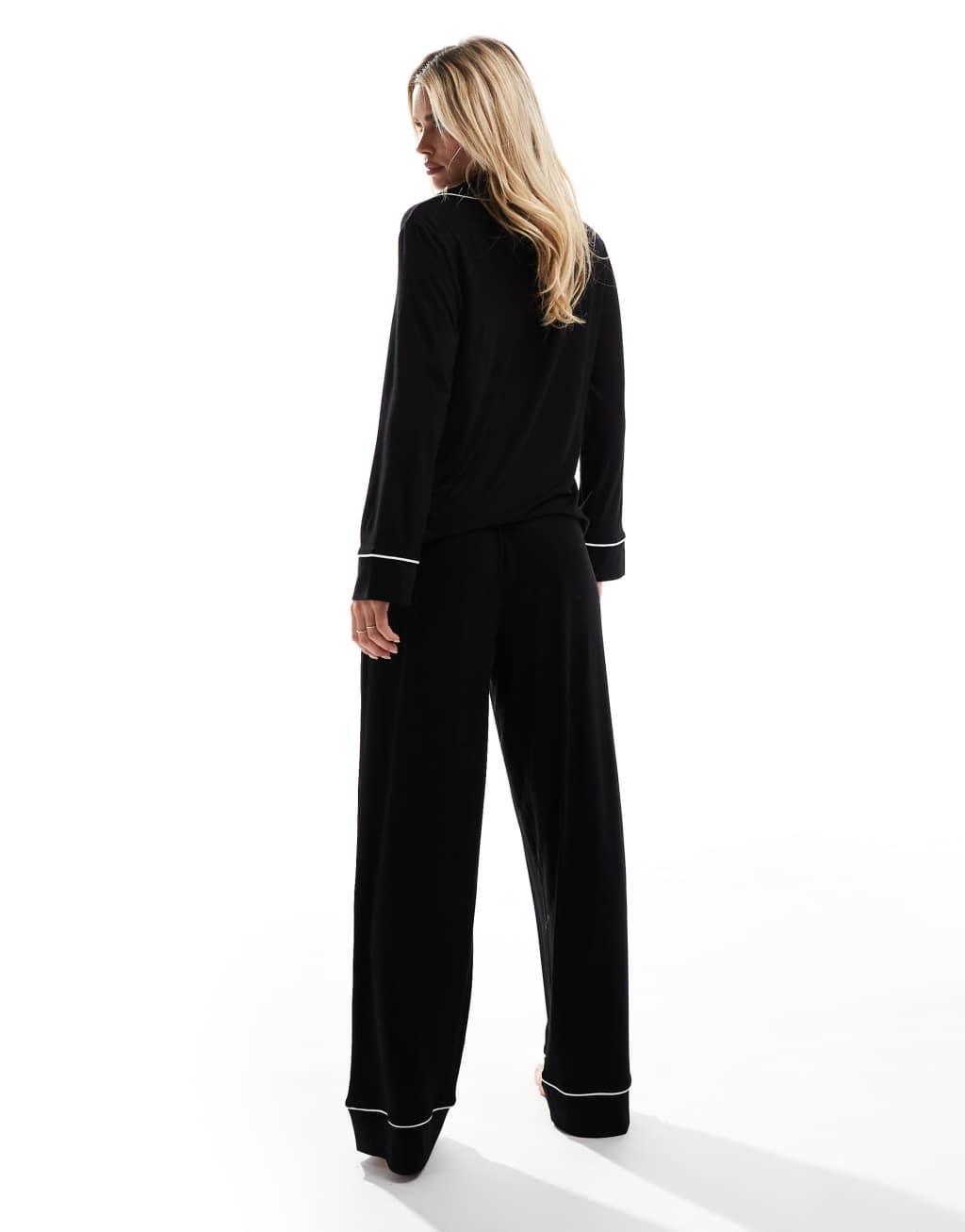 ASOS DESIGN Petite super soft long sleeve shirt & pants pajama set with contrast piping in black Product Image
