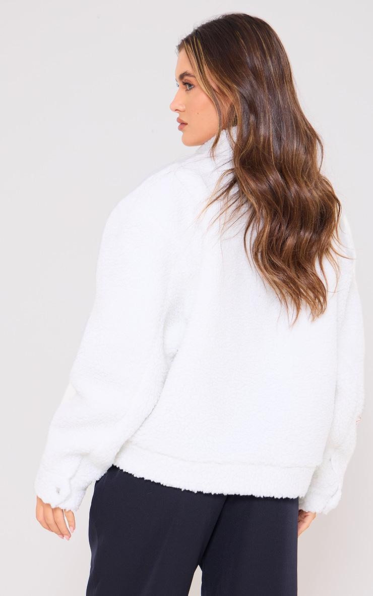 PRETTYLITTLETHING Cream Graphic Zip Up Fleece Jacket Product Image