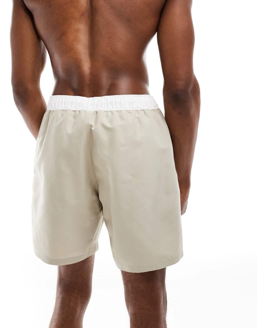 ASOS DESIGN swim shorts with cargo pocket in mid length in stone Product Image