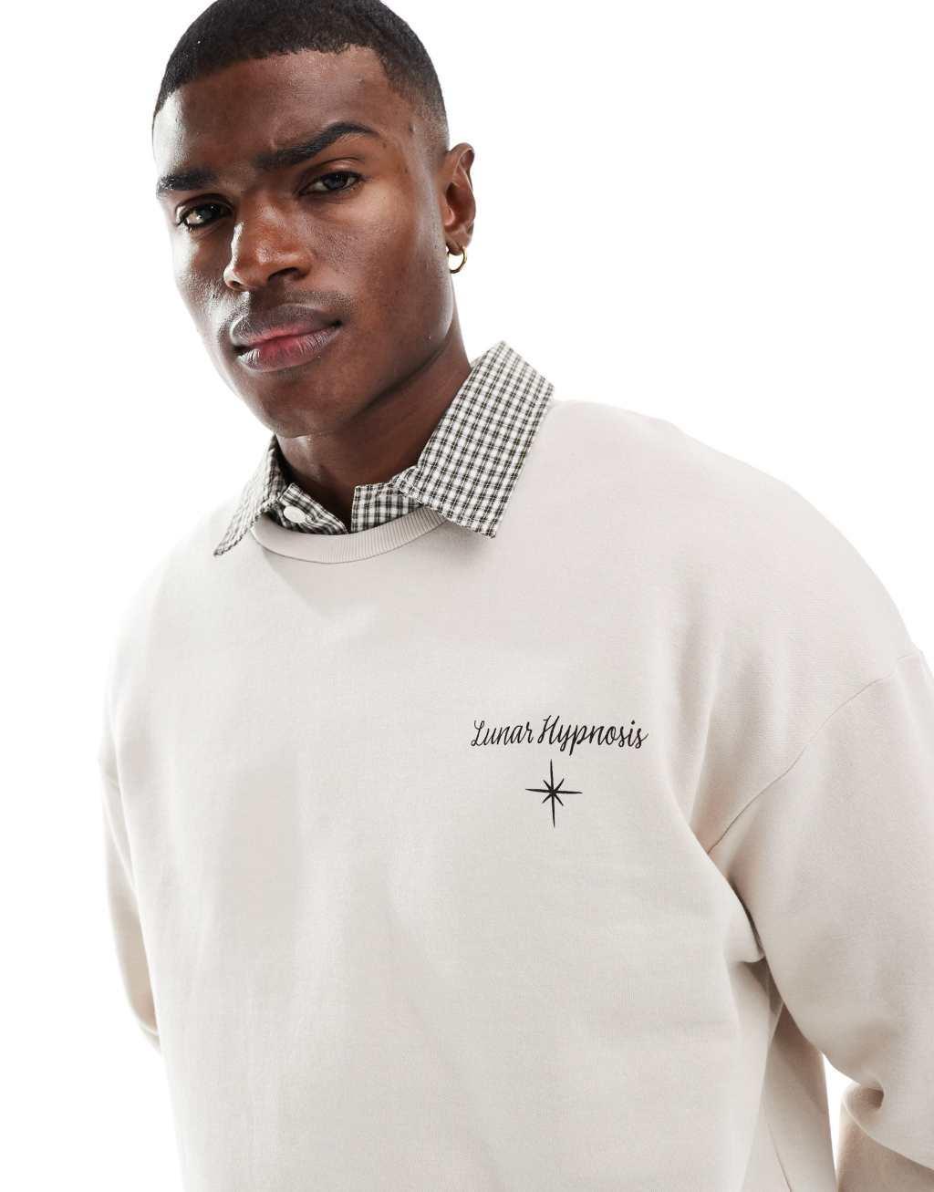 Jack & Jones drop shoulder crew neck sweat with celestial back print in beige Product Image