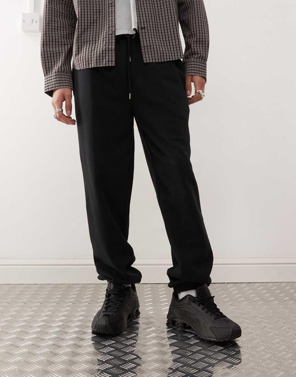 COLLUSION sweatpants in black Product Image