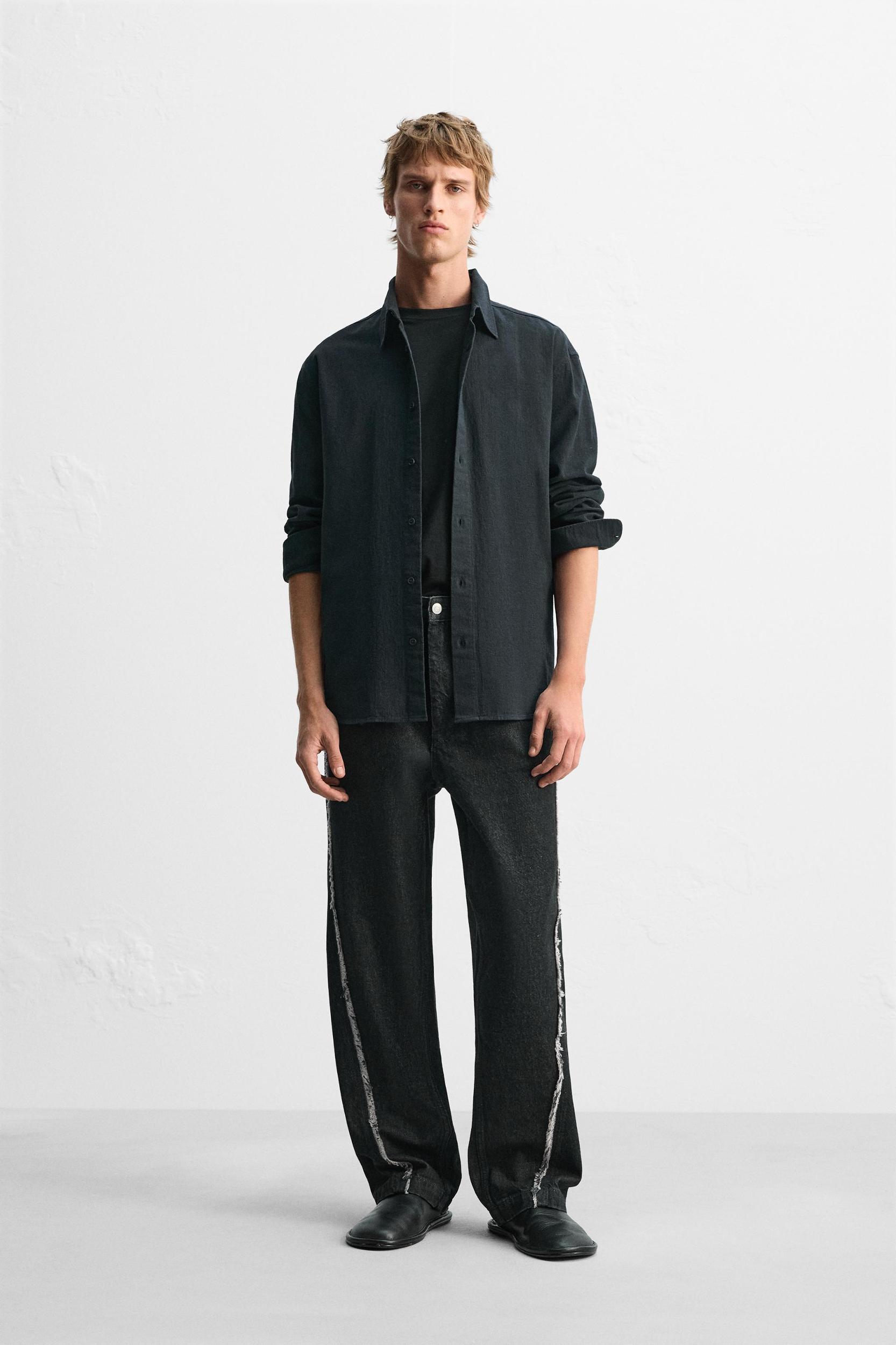 RELAXED FIT FRAYED SEAM JEANS Product Image