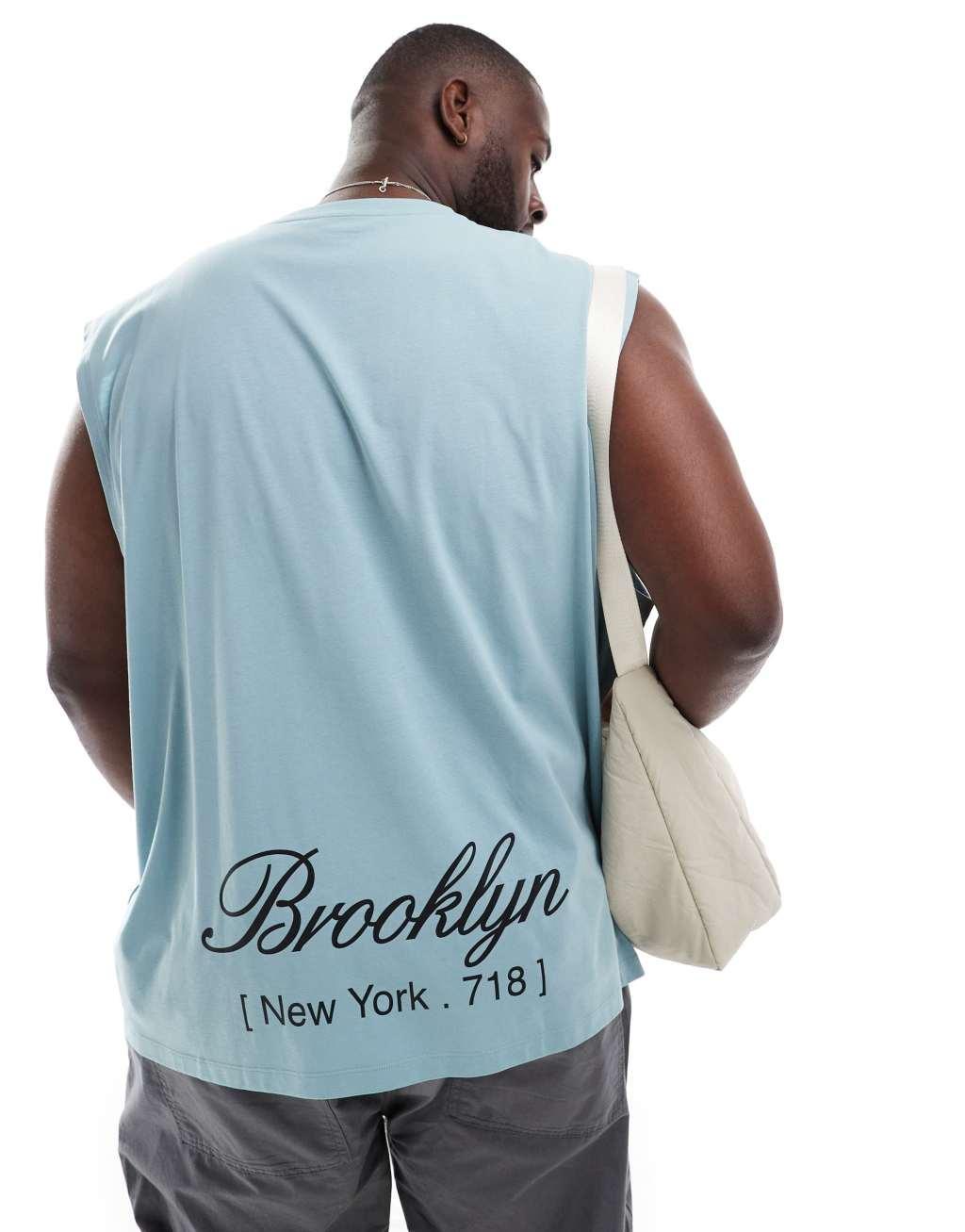 ASOS DESIGN oversized tank top in blue with Brooklyn back print Product Image