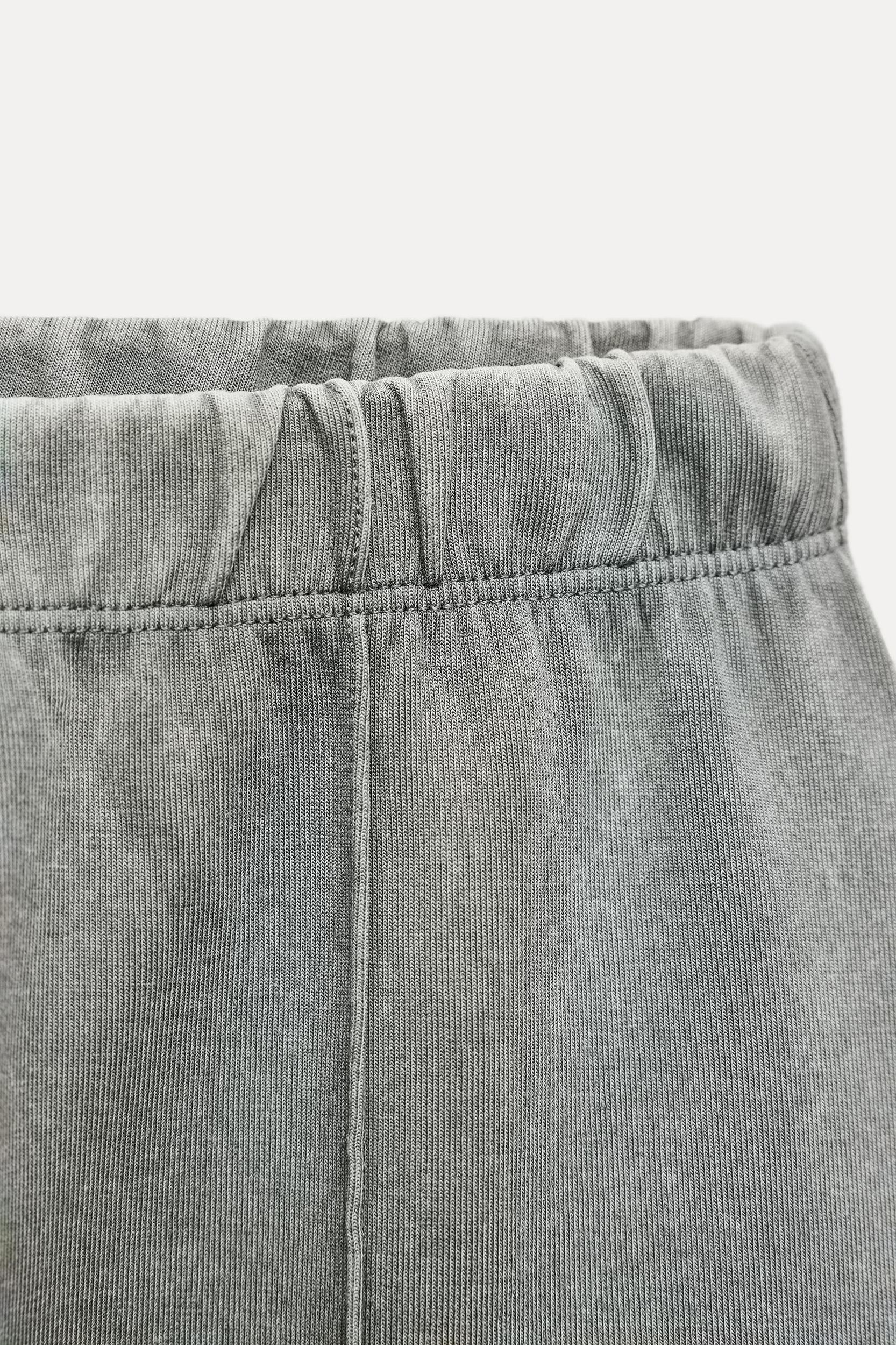 WASHED EFFECT FLARED INTERLOCK PANTS Product Image