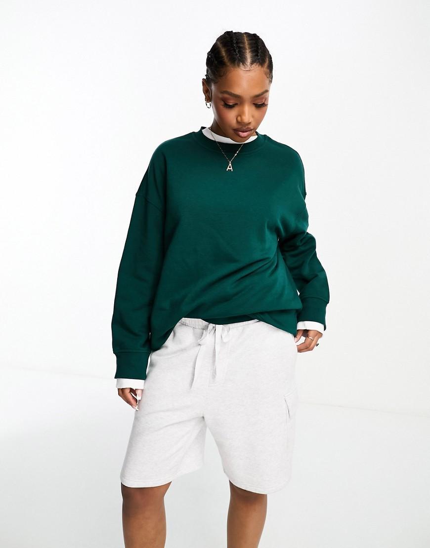 Monki oversized sweatshirt in dark green Product Image