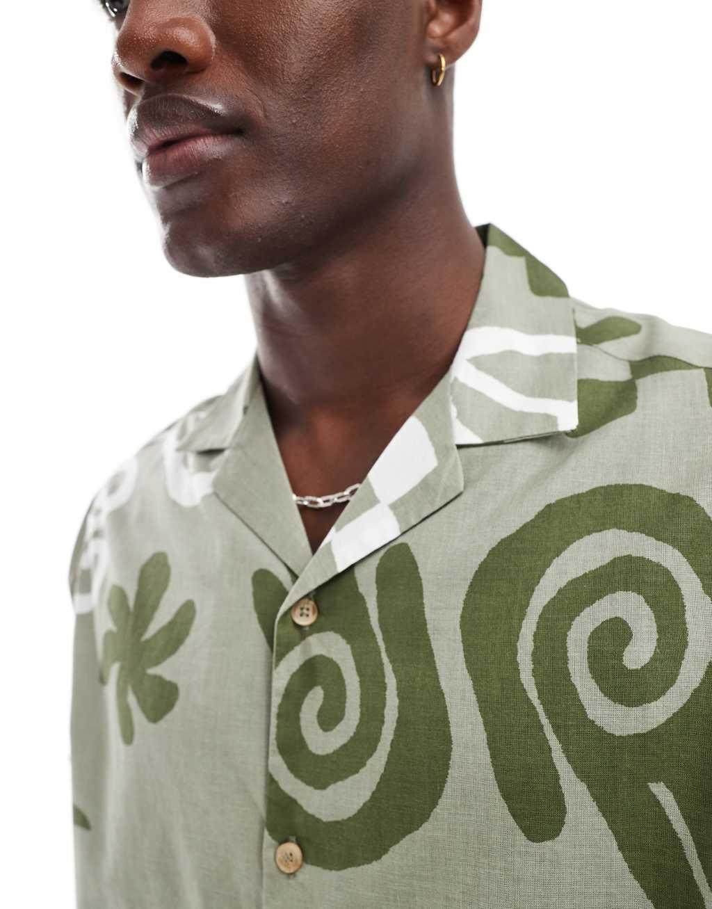 ASOS DESIGN relaxed revere shirt with abstract print in green  Product Image
