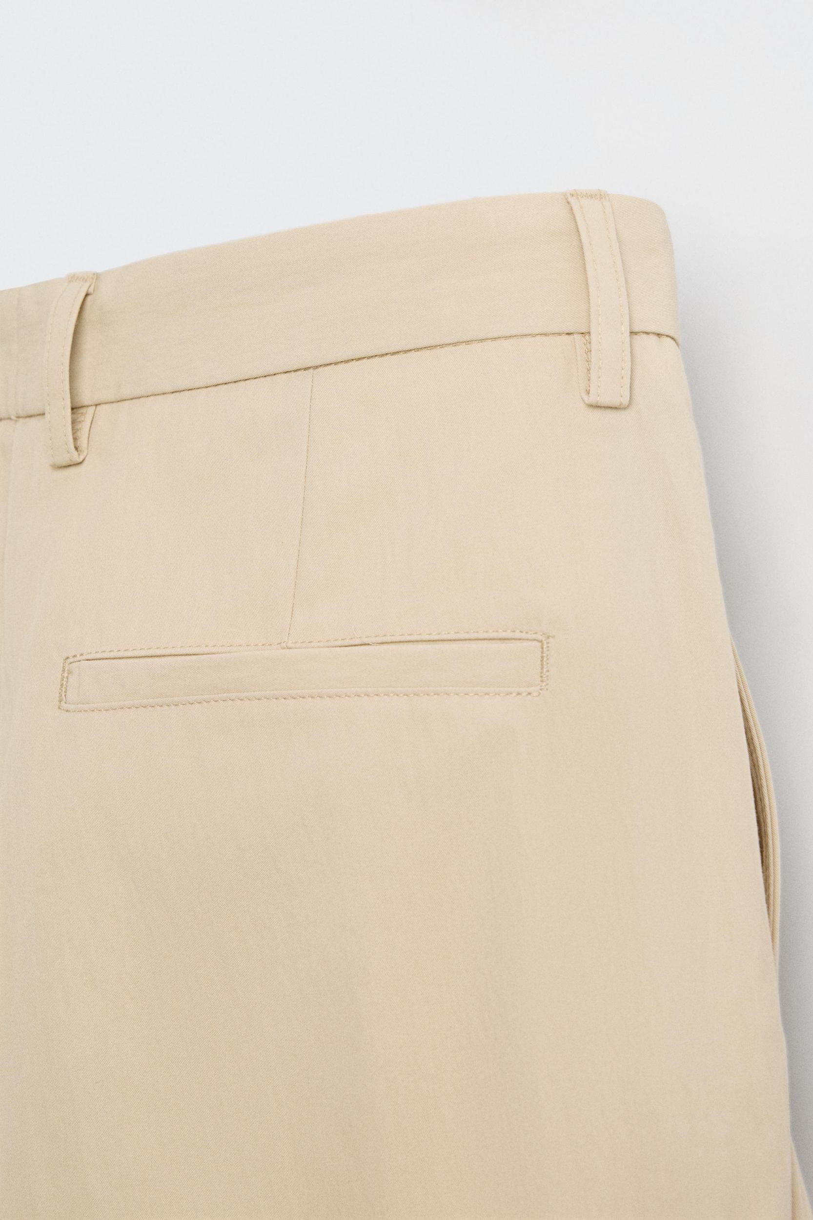 LIMITED EDITION RELAXED FIT PLEATED PANTS Product Image