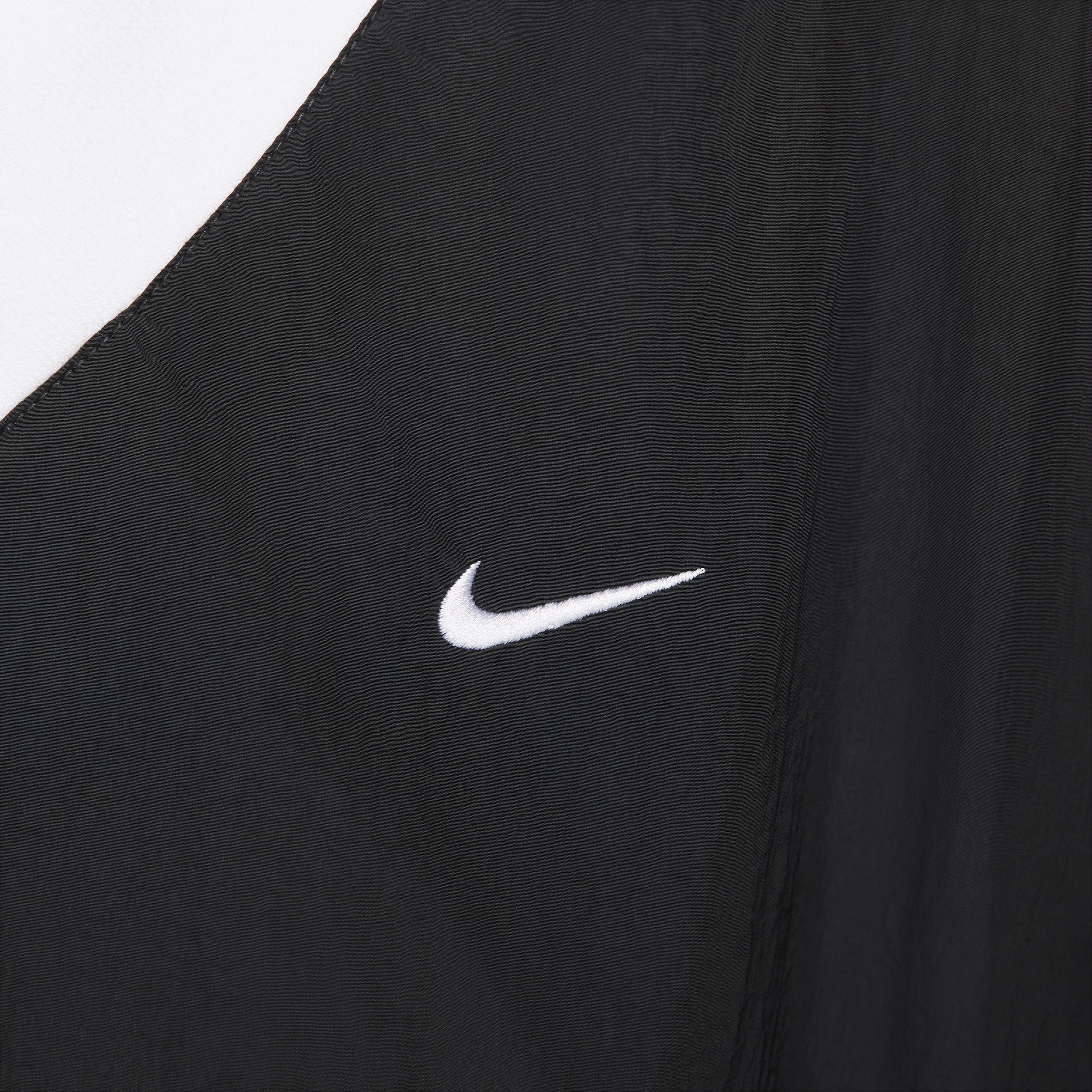 Nike Sportswear Essential Women's Loose UV Woven Long-Sleeve V-Neck Top Product Image