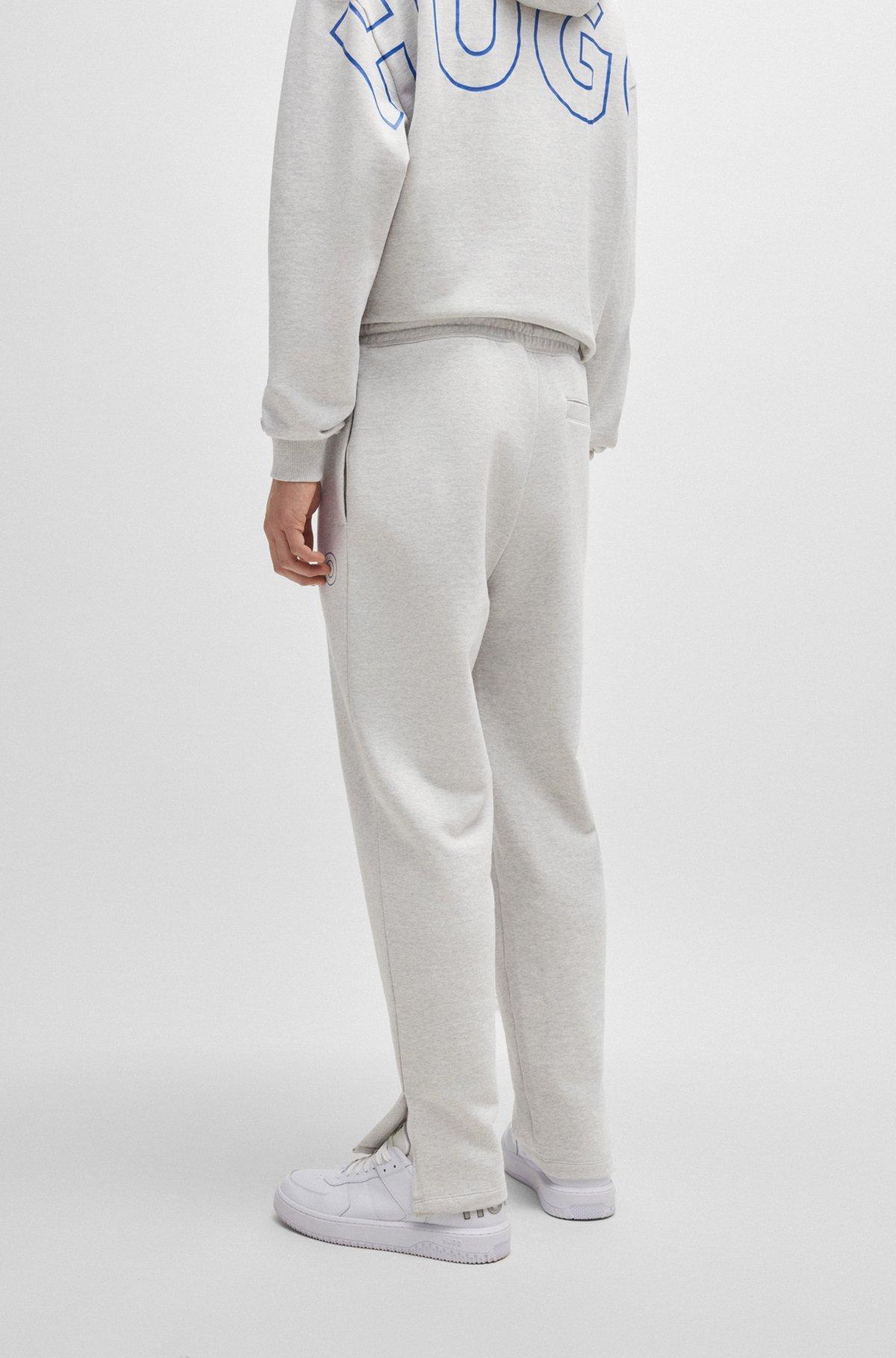 Loose-fit cotton-terry tracksuit bottoms with outline logo Product Image