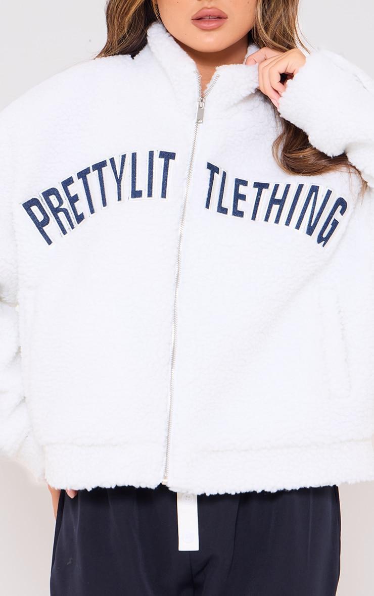 PRETTYLITTLETHING Cream Graphic Zip Up Fleece Jacket Product Image
