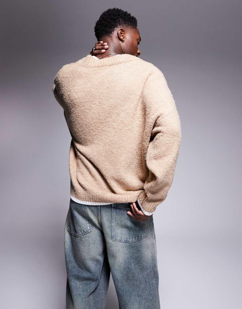ASOS DESIGN oversized boxy fit textured knit v neck sweater with chest pattern and tipping in beige Product Image