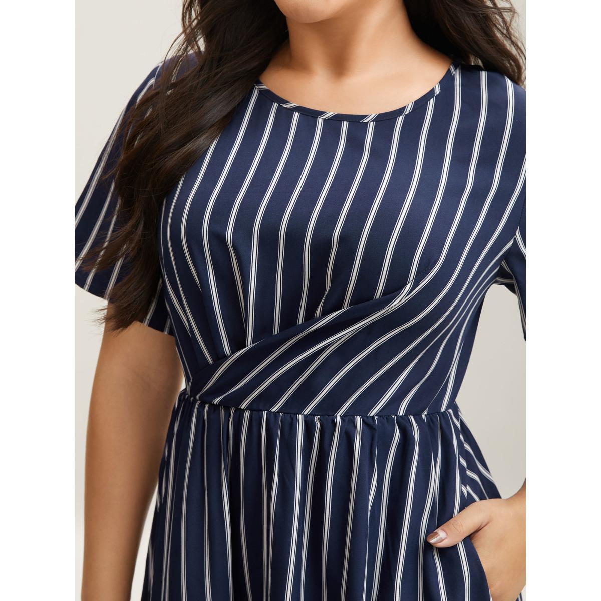 Plus Size Striped Stretchy Waist Defining Pockets Dress Indigo Women At the Office Pleated Round Neck Short sleeve Curvy BloomChic 26/4X Product Image