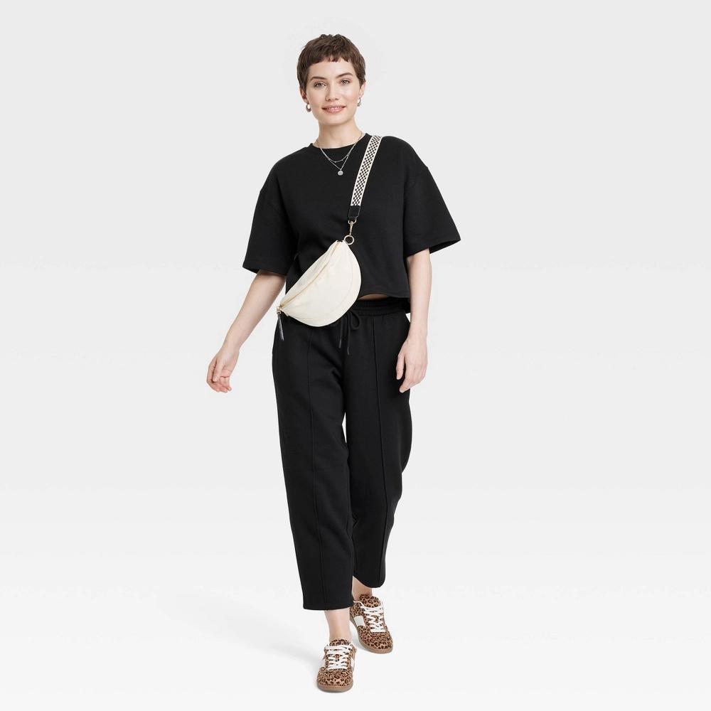 Women's Leisure Studio Short Sleeve Fleece Top - Universal Thread™ Black XS: Crew Neck, Knit Product Image