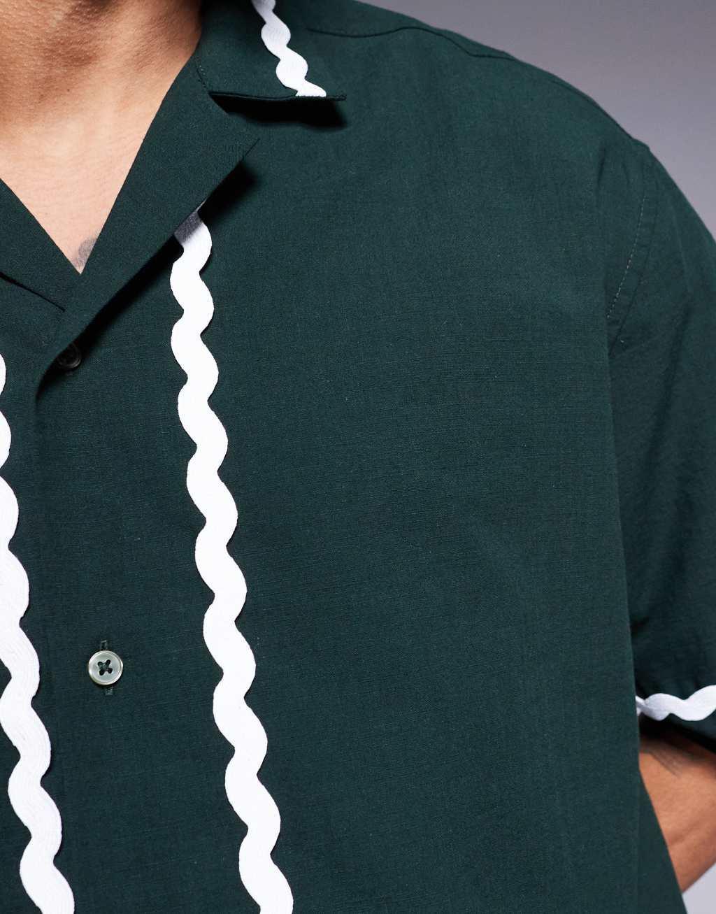 ASOS DESIGN oversized boxy shirt with tape detail in dark green Product Image