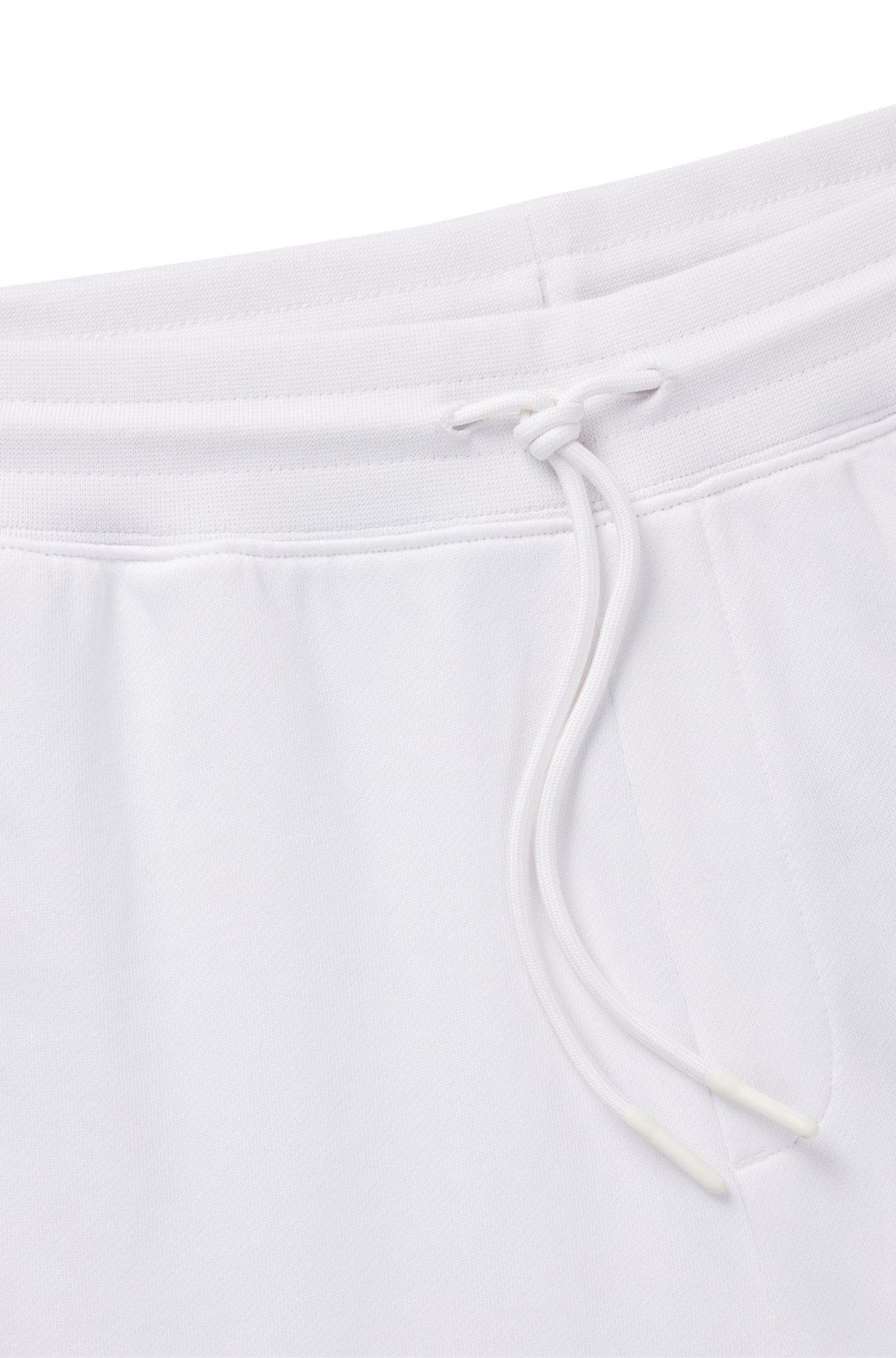 Cotton-terry tracksuit bottoms with Happy HUGO logo Product Image