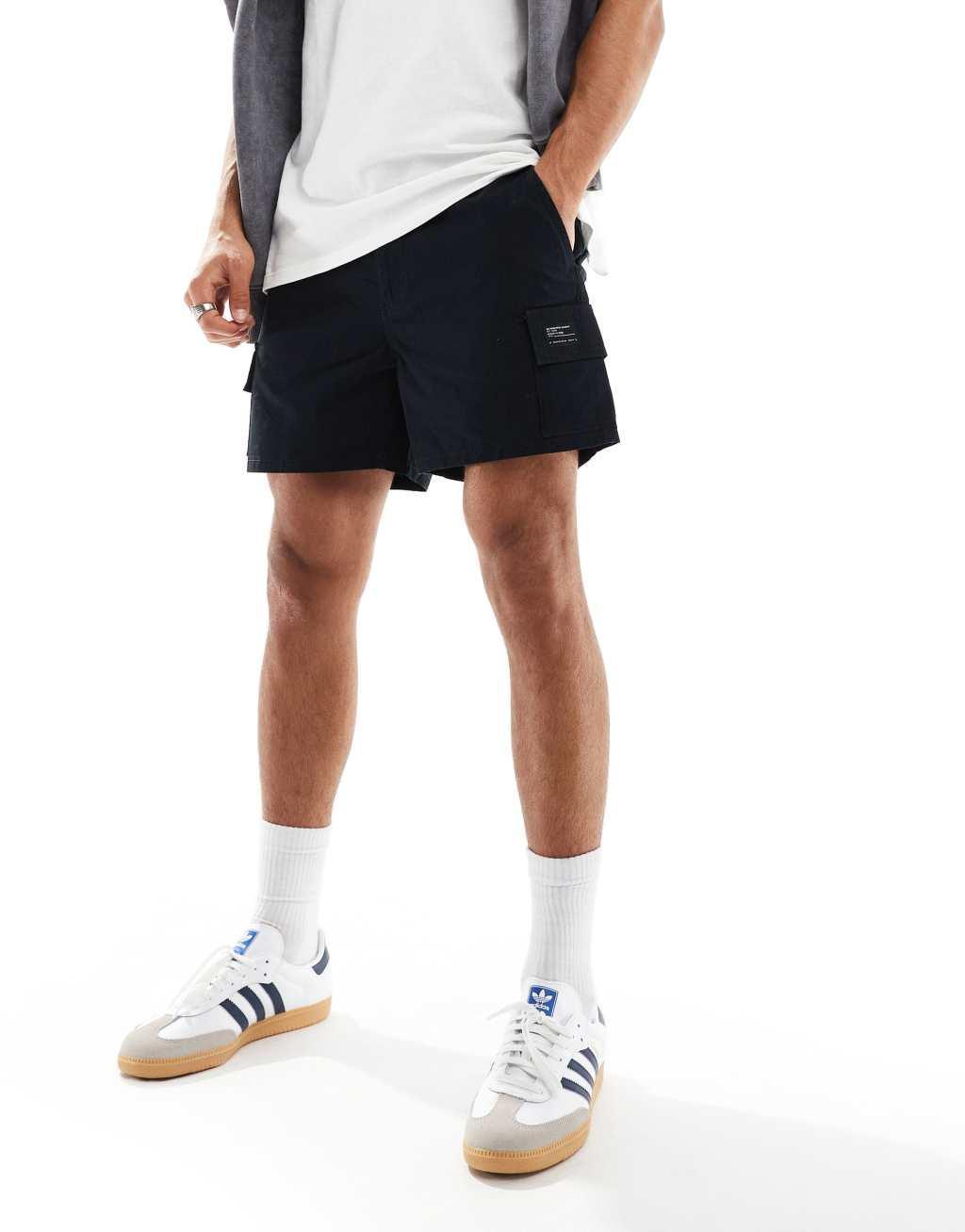 ASOS DESIGN slim cargo shorts with patch in black Product Image