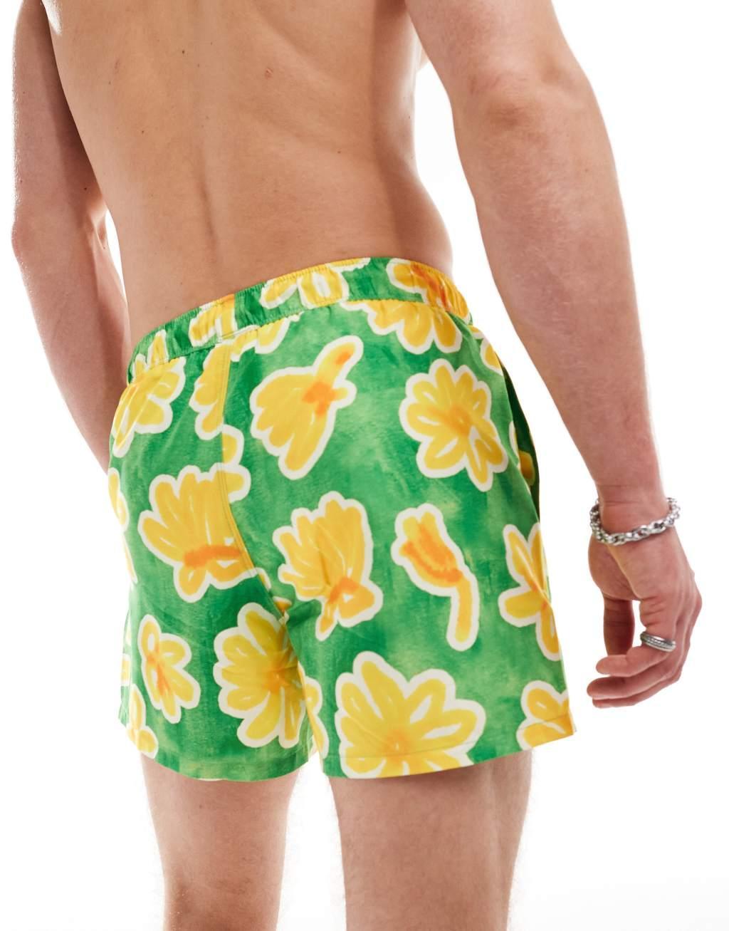 ASOS DESIGN swim shorts in short length in green floral print Product Image
