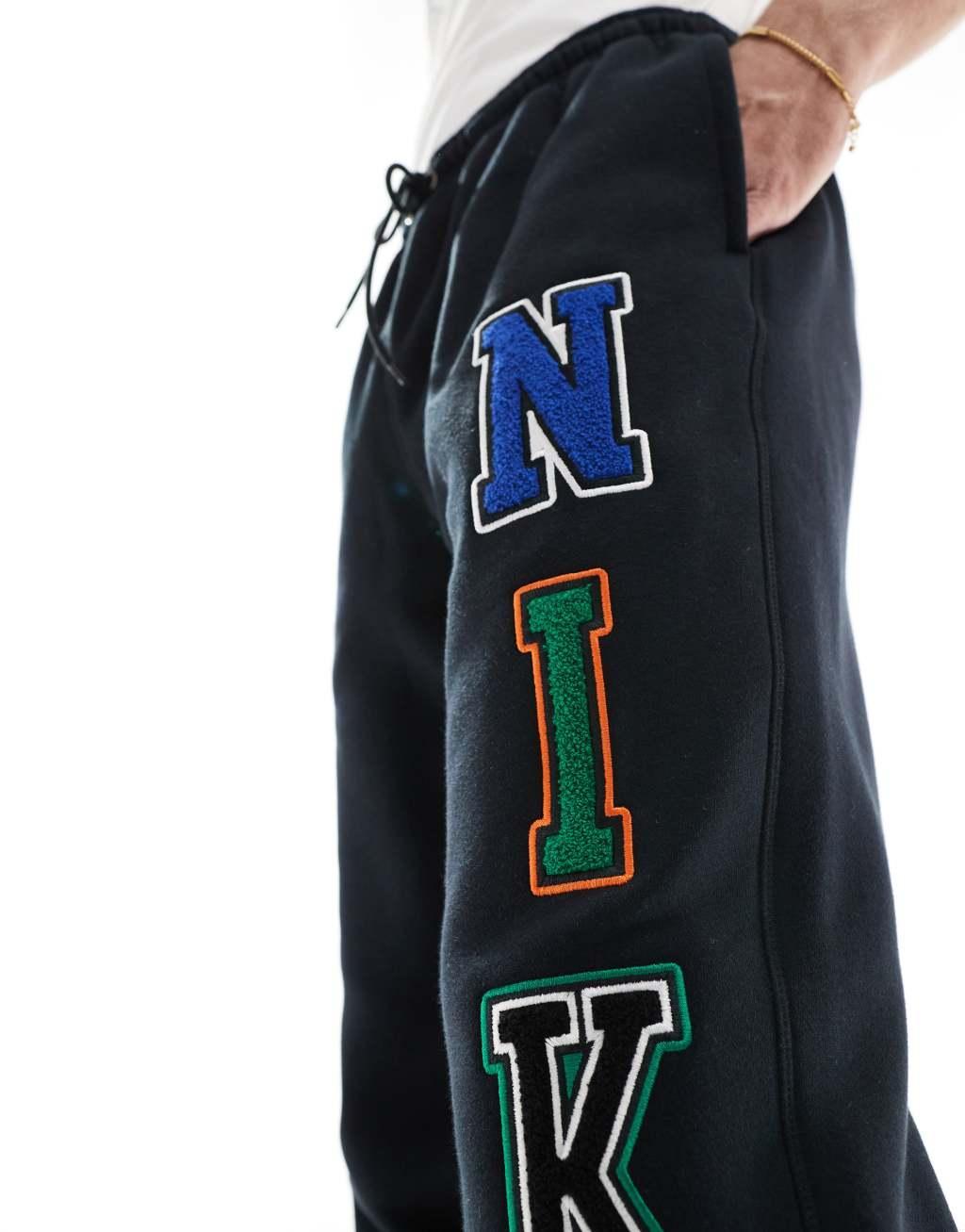 Nike Club chenille logo sweatpants in black Product Image