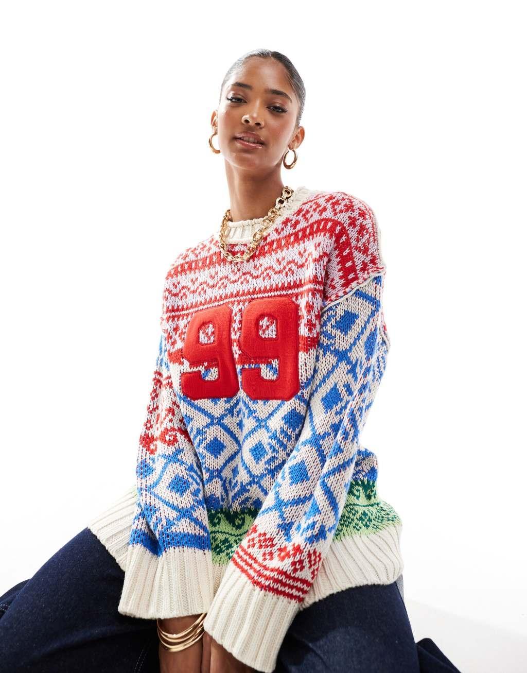 ASOS DESIGN oversized patchwork fairisle festive sweater in blue and red Product Image