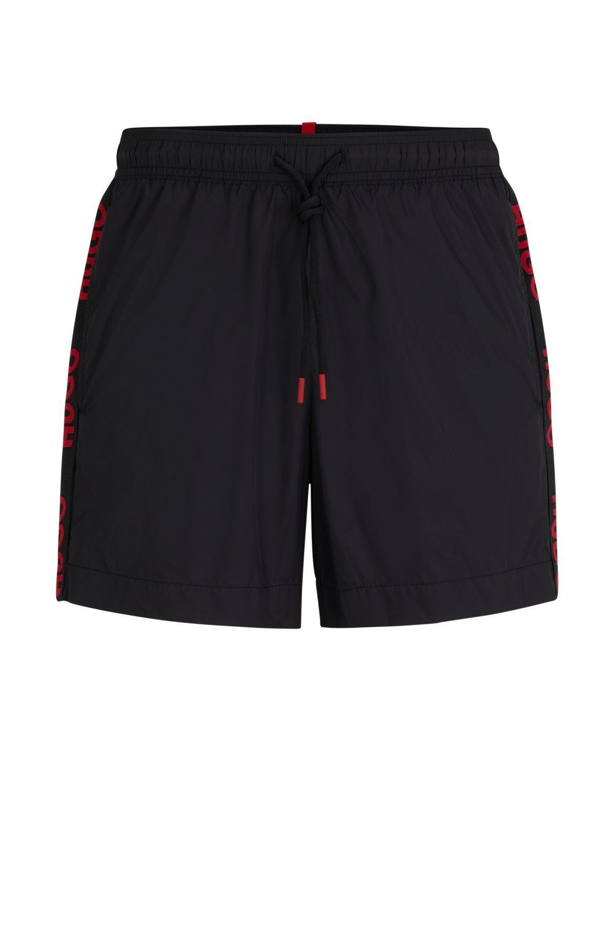 Fully lined swim shorts with logo tape Product Image