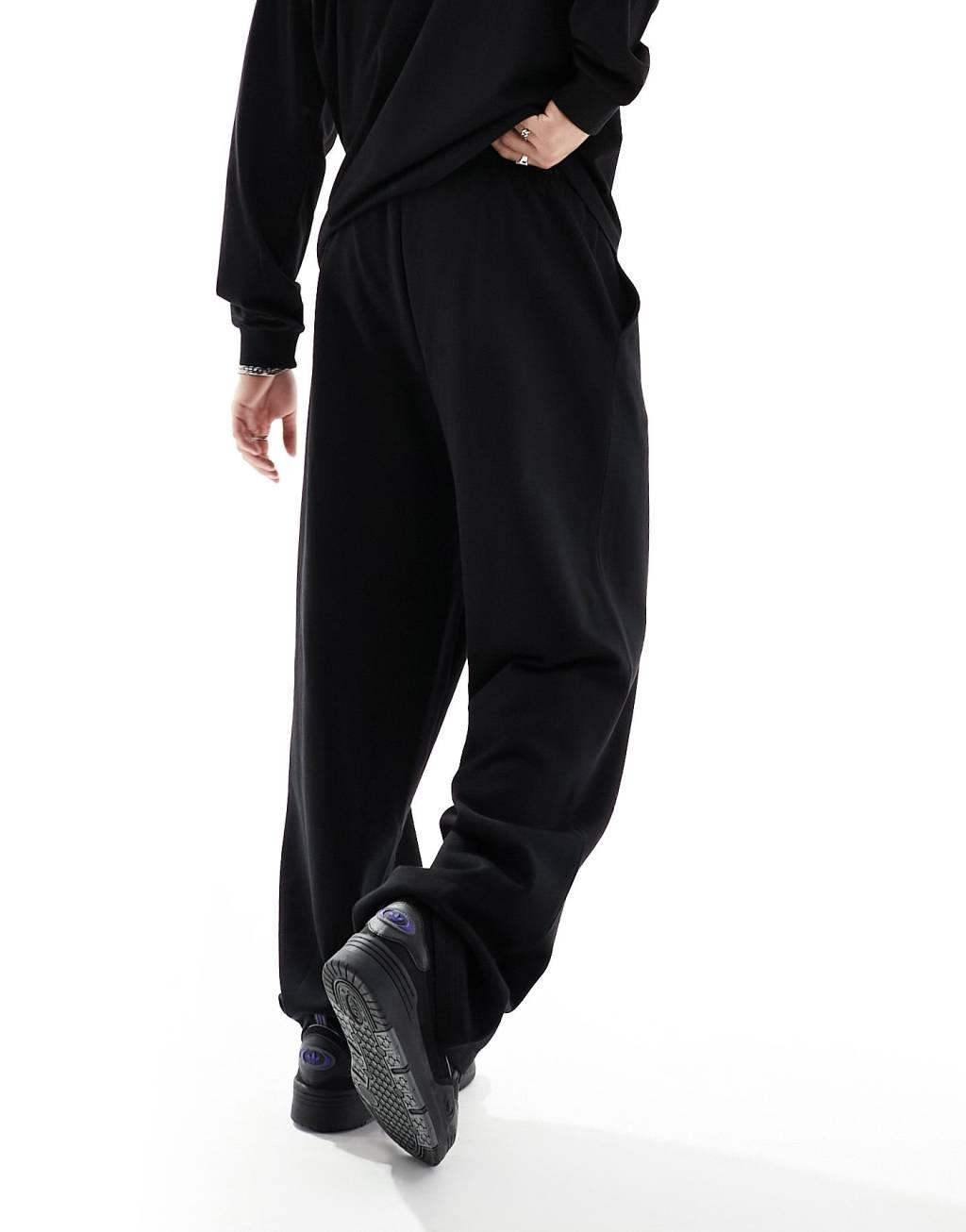COLLUSION relaxed sweatpants in black Product Image