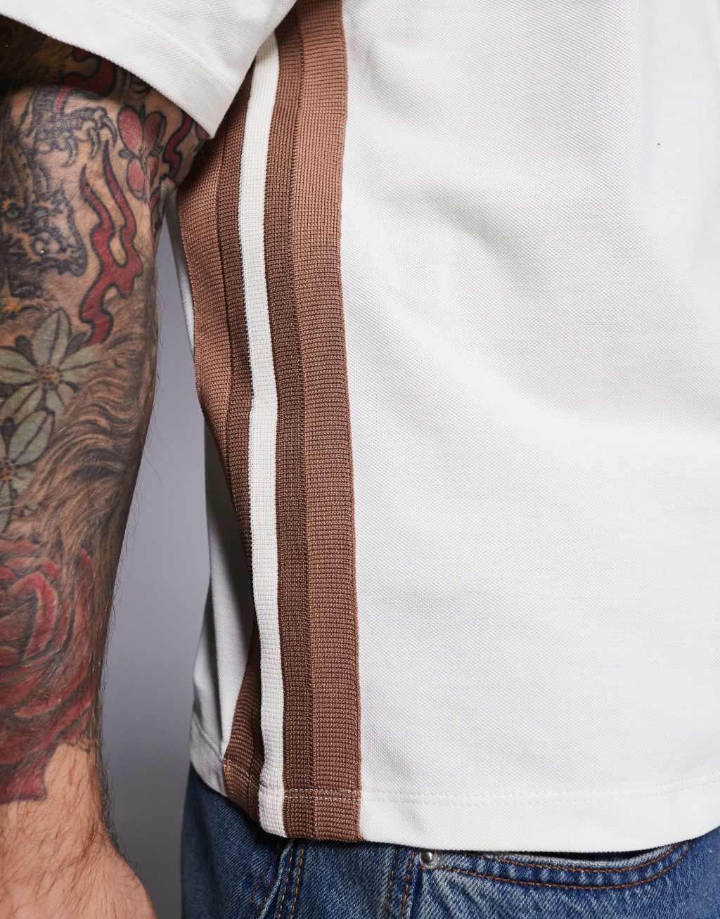 ASOS DESIGN boxy relaxed T-shirt with paneling and text graphic in cream pique Product Image