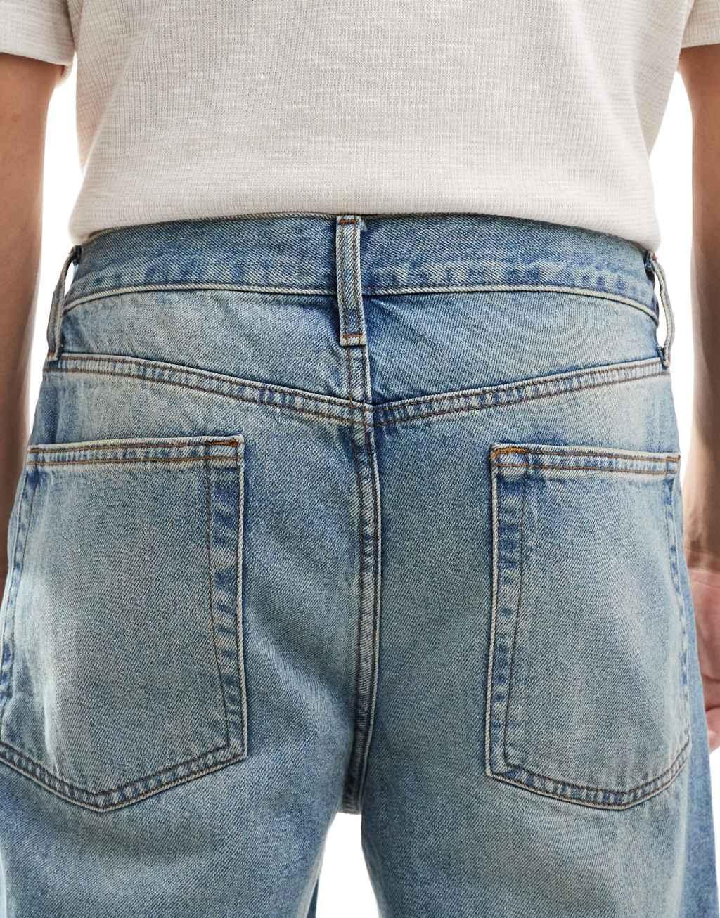 ASOS DESIGN straight leg jeans in mid blue wash Product Image