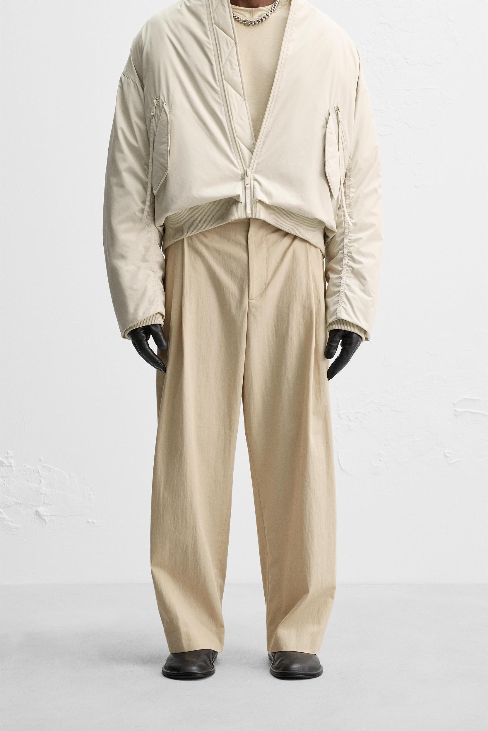 LIMITED EDITION RELAXED FIT PLEATED PANTS Product Image