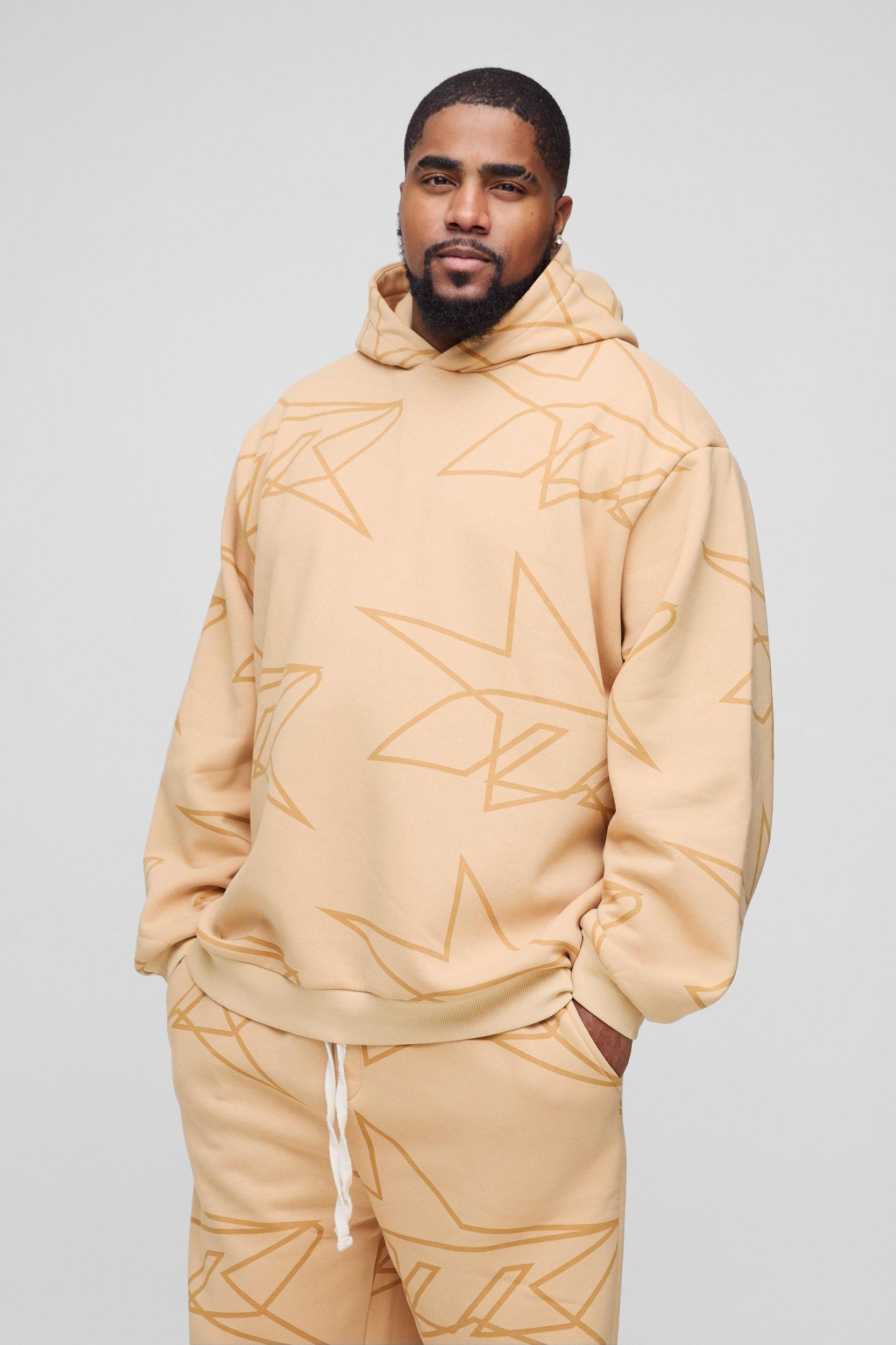 Plus Oversized Star All Over Printed Gusset Flare Hooded Tracksuit | boohooMAN USA Product Image