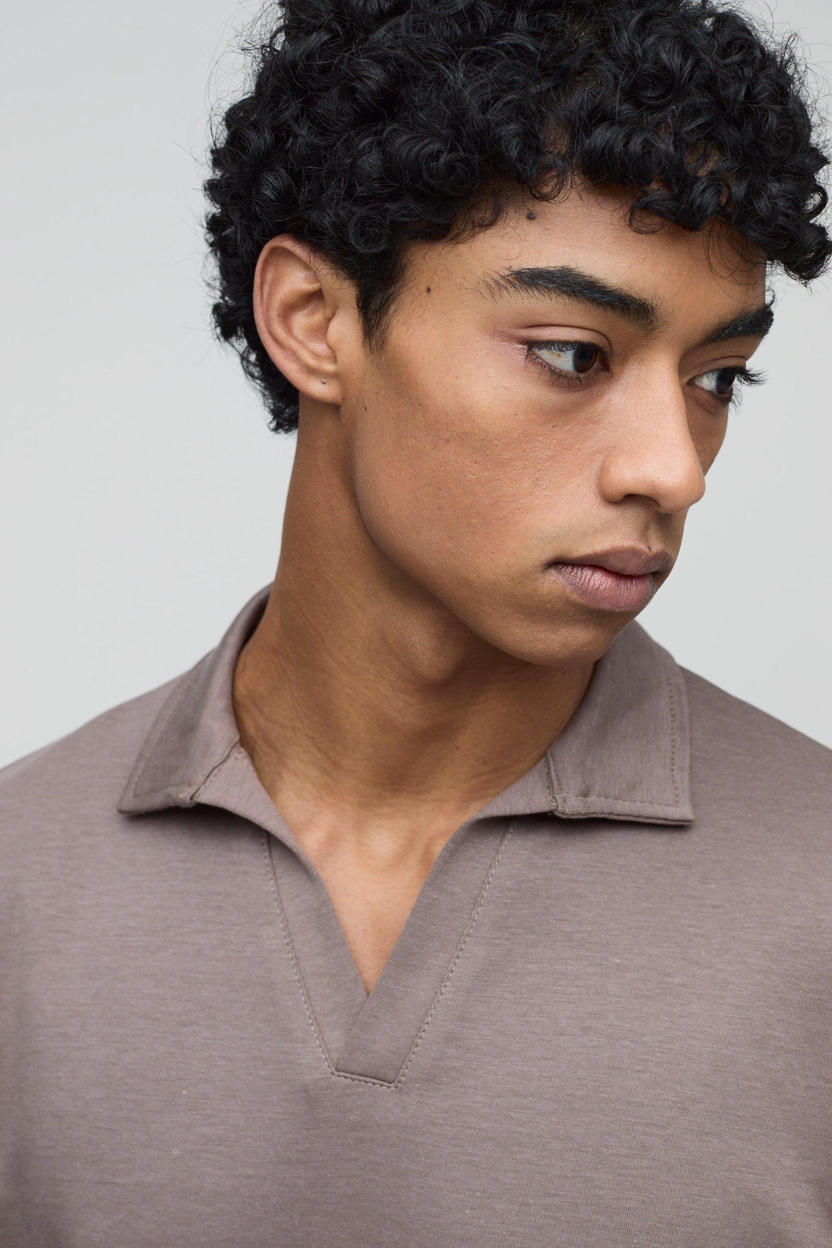 Regular Fit Heavyweight Interlock V Neck Polo | boohooMAN USA Product Image