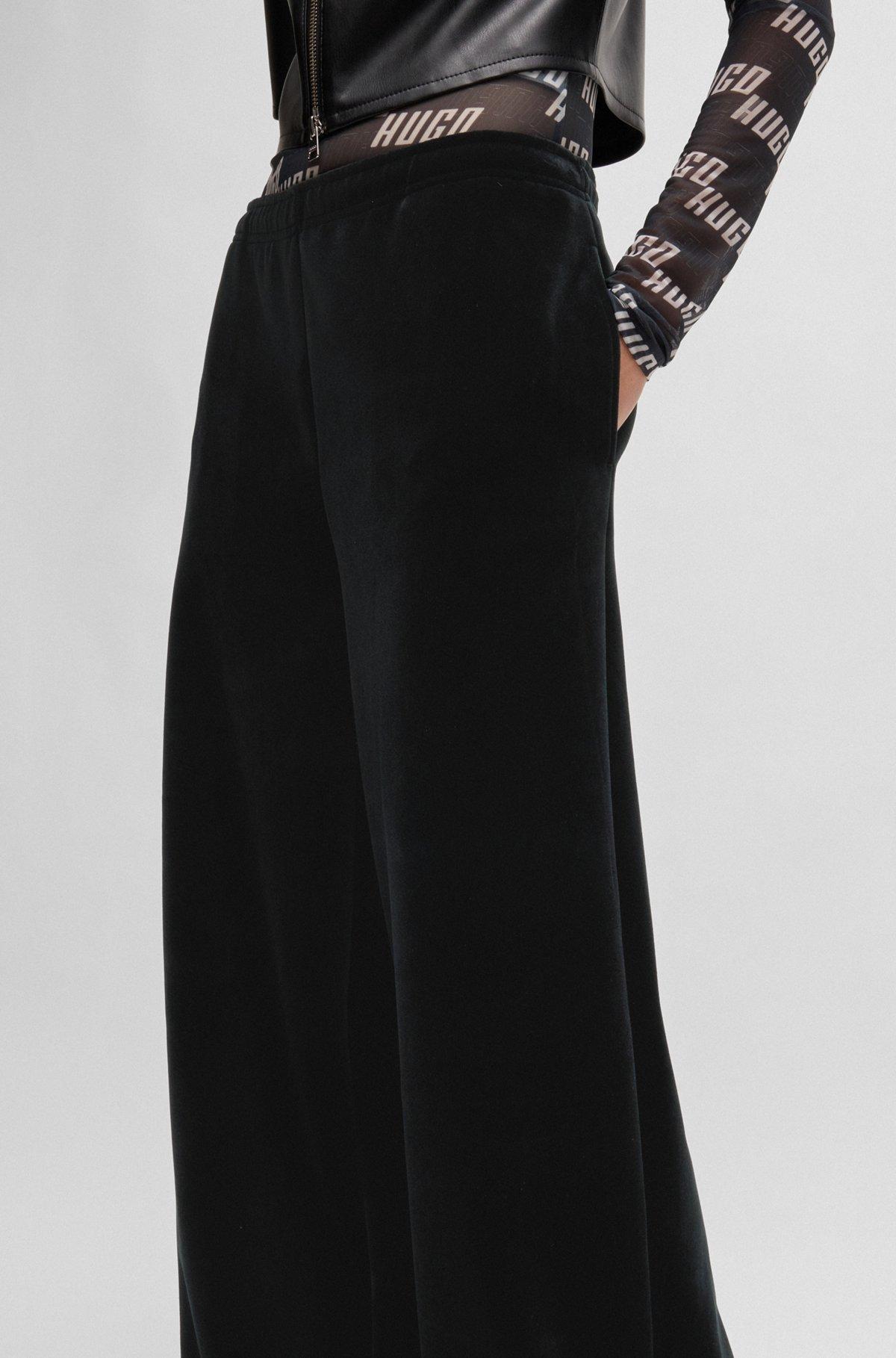 Relaxed-fit tracksuit bottoms in stretch velour Product Image