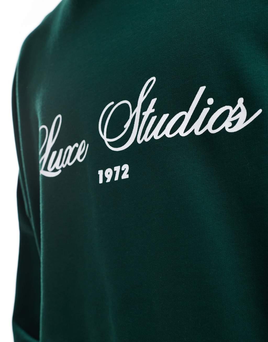 ASOS DESIGN extreme oversized crew neck sweatshirt with text print in dark green Product Image