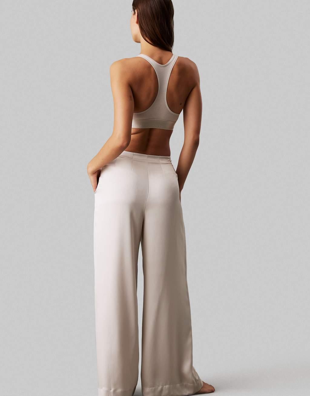 Calvin Klein Modern Cotton unlined racerback bralet with metallic logo taping in cream Product Image