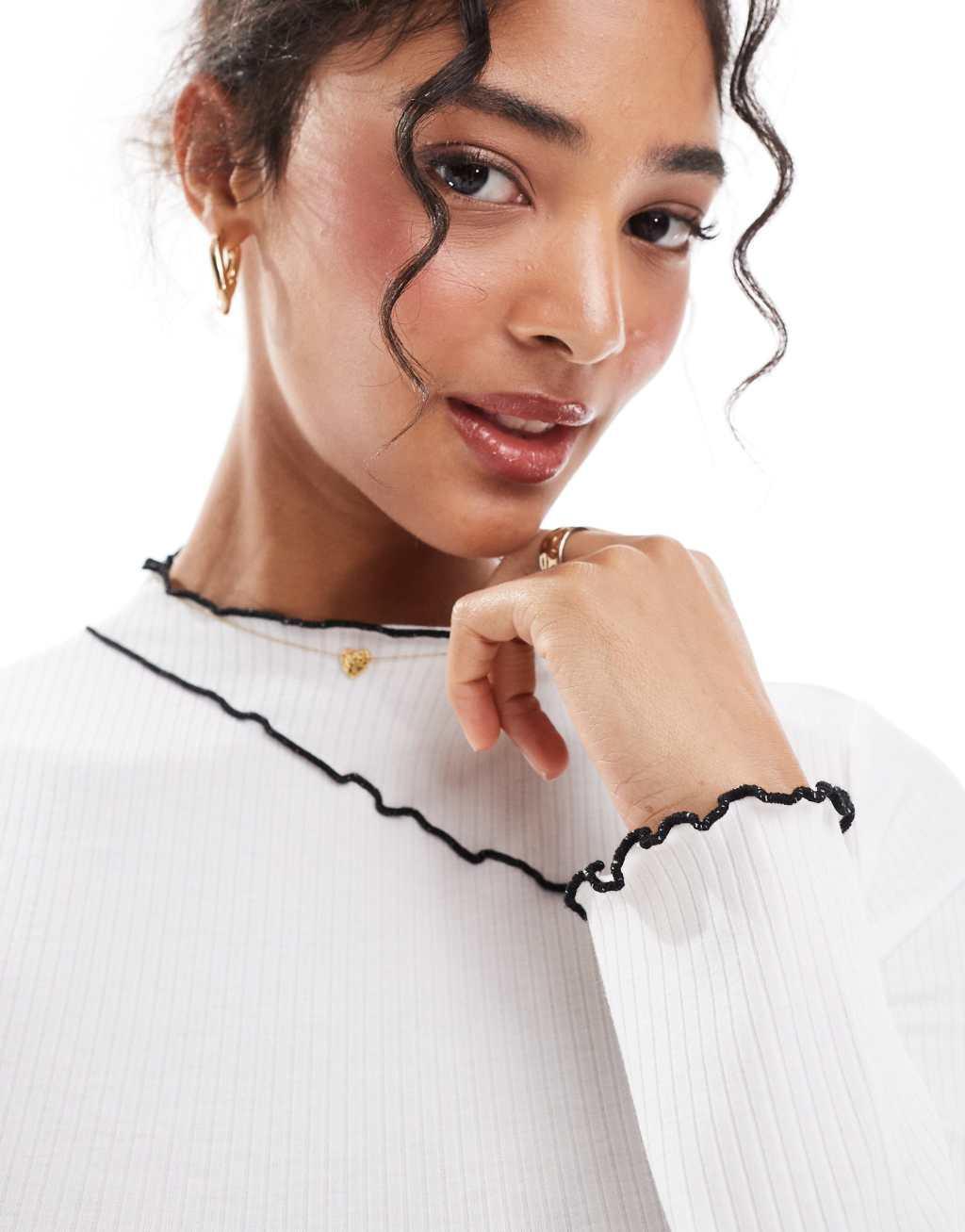 Pieces long sleeved top with contrast lettuce edge detailing in white Product Image