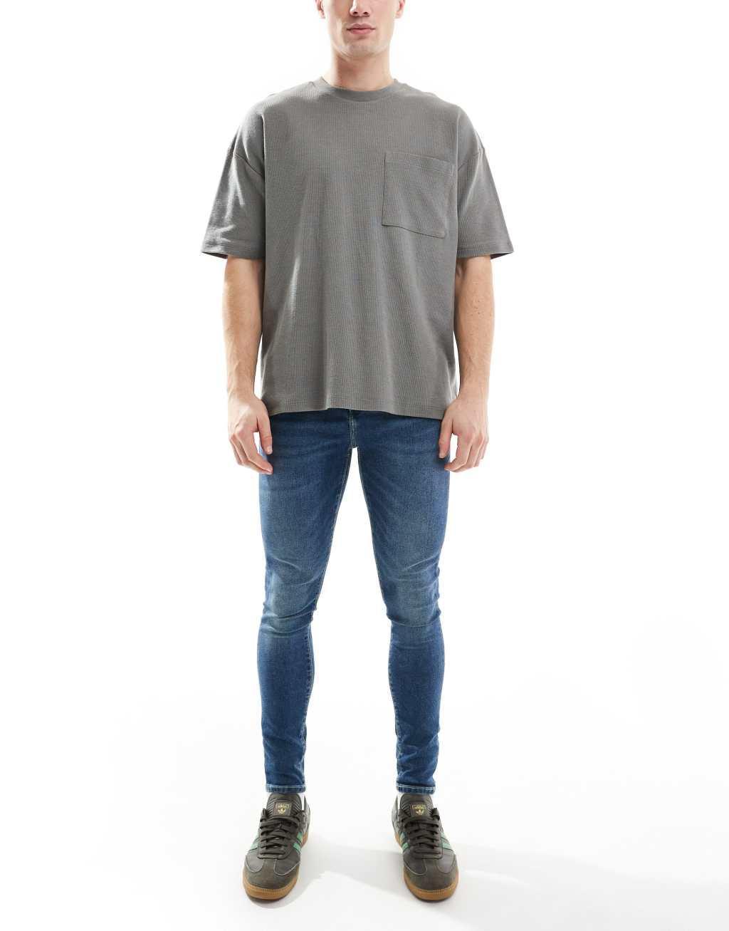 ASOS DESIGN power stretch jeans in dark wash blue Product Image