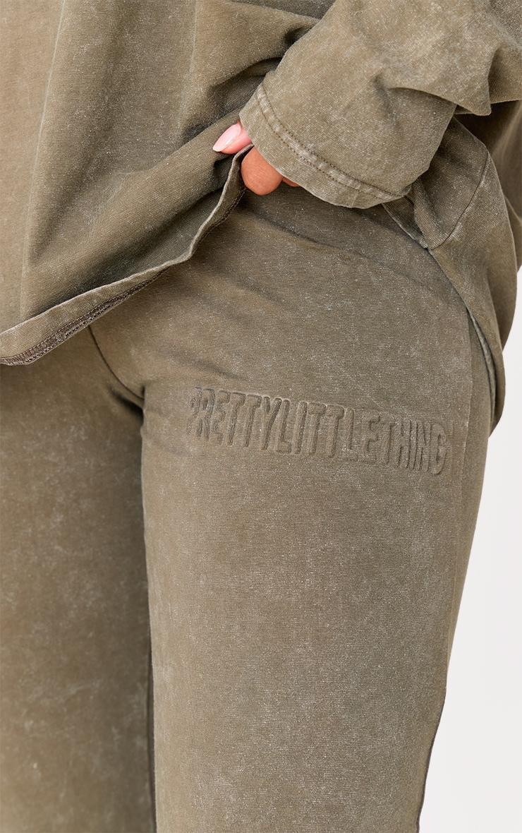 PRETTYLITTLETHING Olive Embossed Logo Washed Skinny Flare Pant Product Image