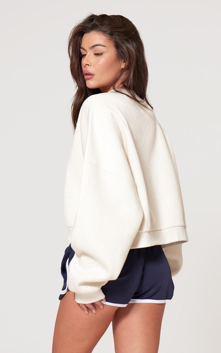 PRETTYLITTLETHING Cream Athletics Club Embossed Oversized Boxy Sweatshirt Product Image