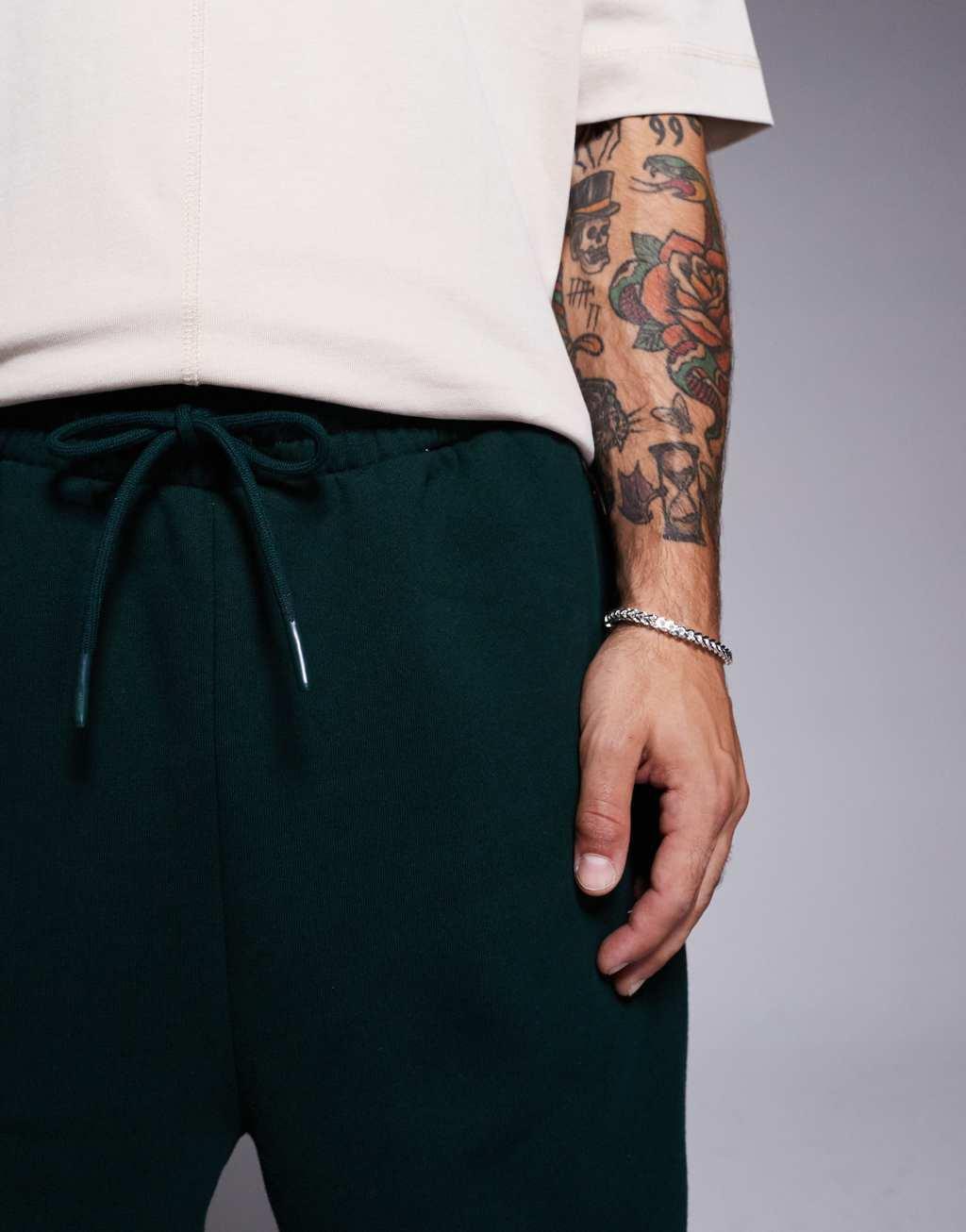 ASOS DESIGN premium heavyweight oversized sweatpants in forest green Product Image