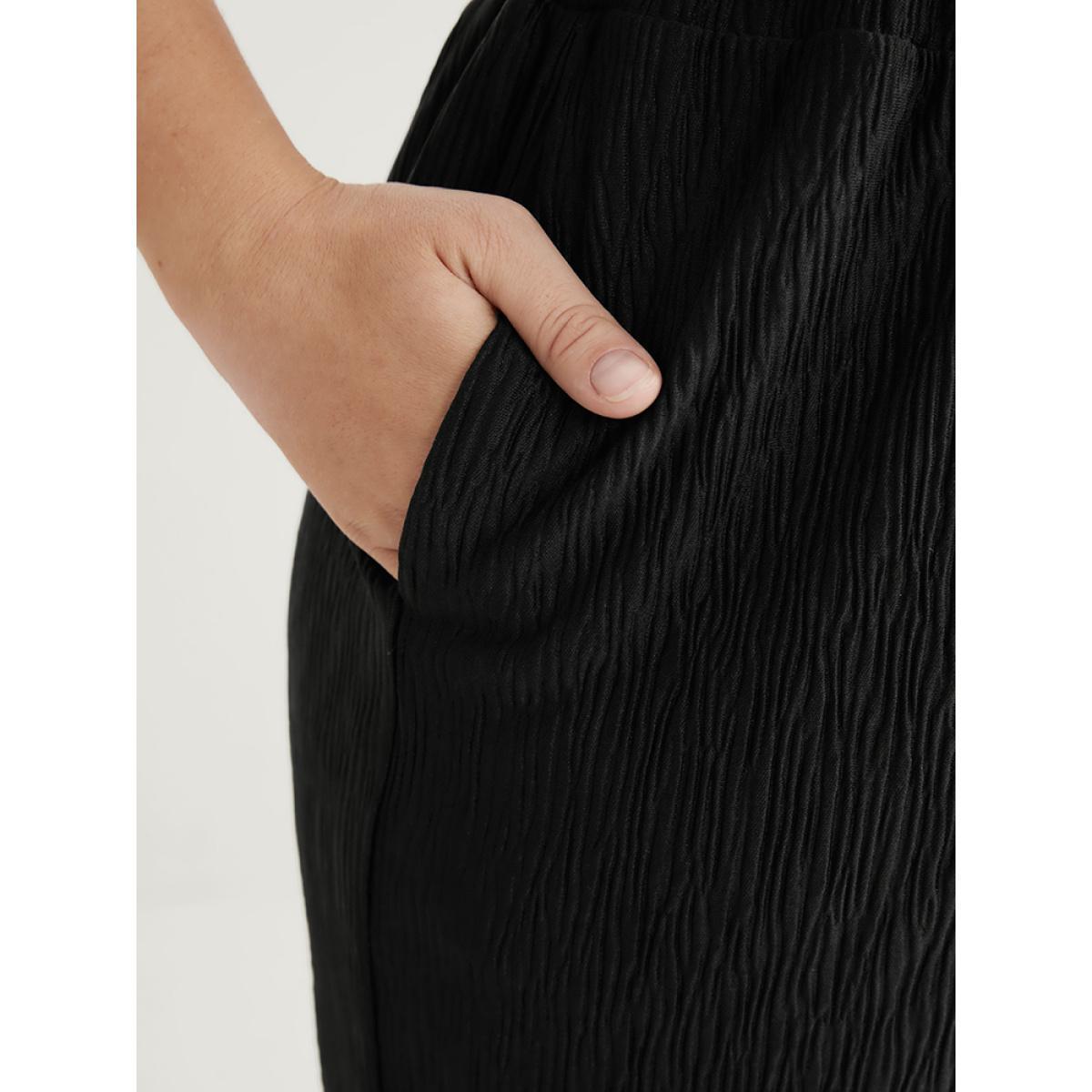 Plus Size Solid Pocket Textured Elastic Waist Pants Women Black Casual Mid Rise Dailywear Pants BloomChic 28/5X Product Image