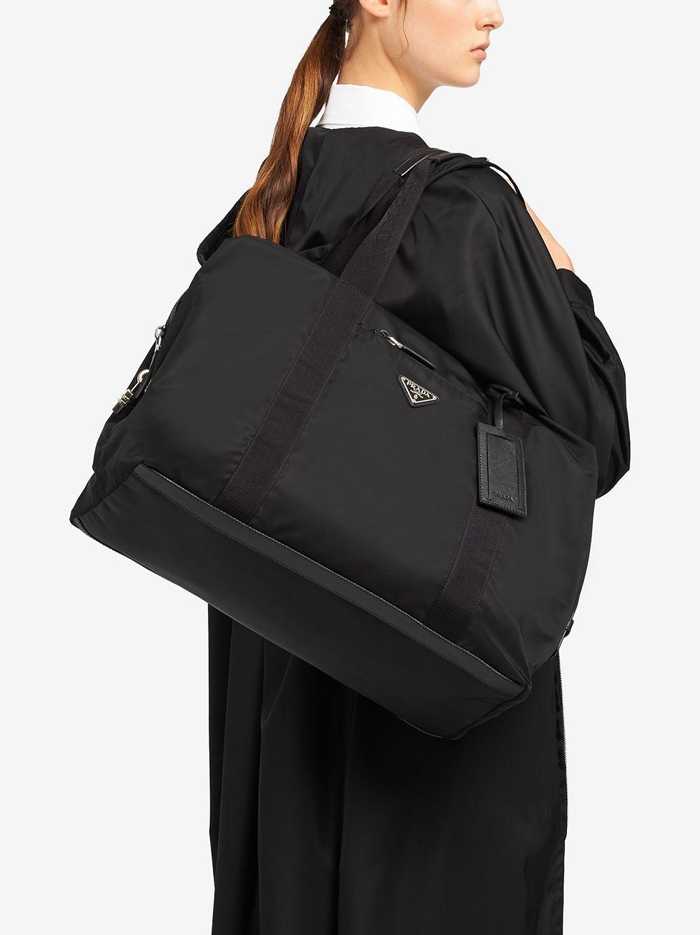 Re-Nylon triangle logo holdall bag Product Image